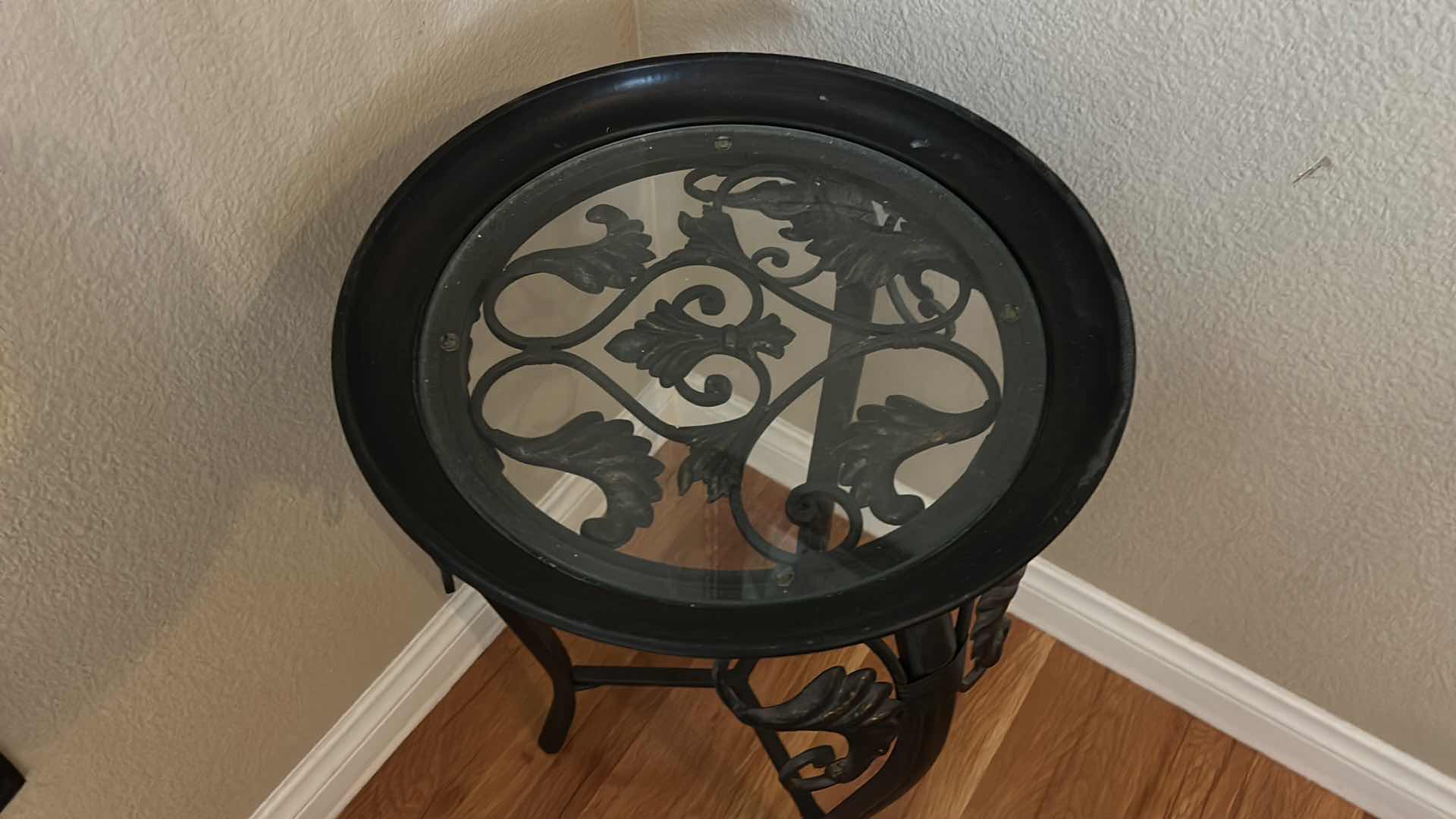 Photo 1 of ROUND METAL ACCENT TABLE WITH GLASS TOP, SCROLLWORK BASE, THREE LEG FRAME 14 1/2” x H2’