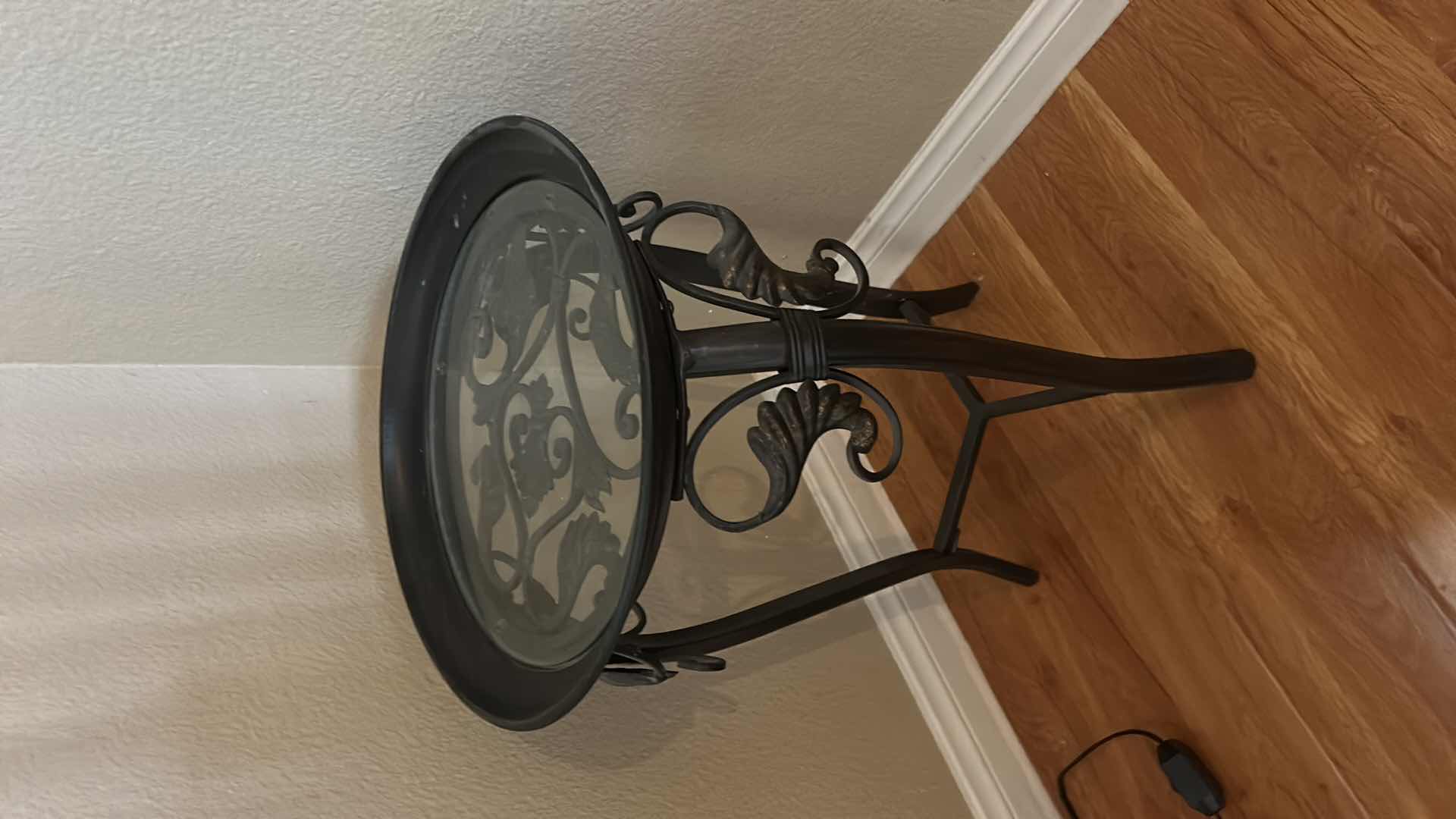 Photo 1 of ROUND METAL ACCENT TABLE WITH GLASS TOP, SCROLLWORK BASE, THREE LEG FRAME 14 1/2” x H2’