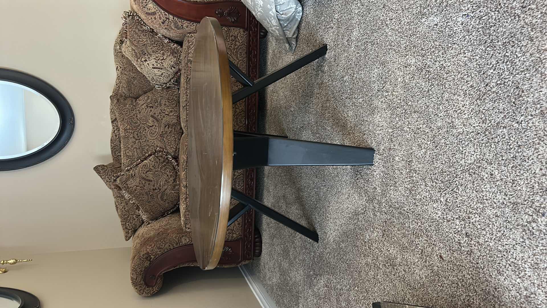 Photo 1 of ROUND WOOD COCKTAIL TABLE WITH BLACK LEGS 3’ X H20”