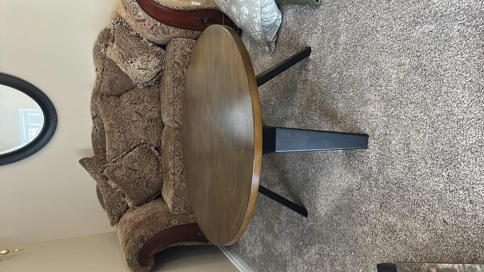 Photo 1 of ROUND WOOD COCKTAIL TABLE WITH BLACK LEGS 3’ X H20”