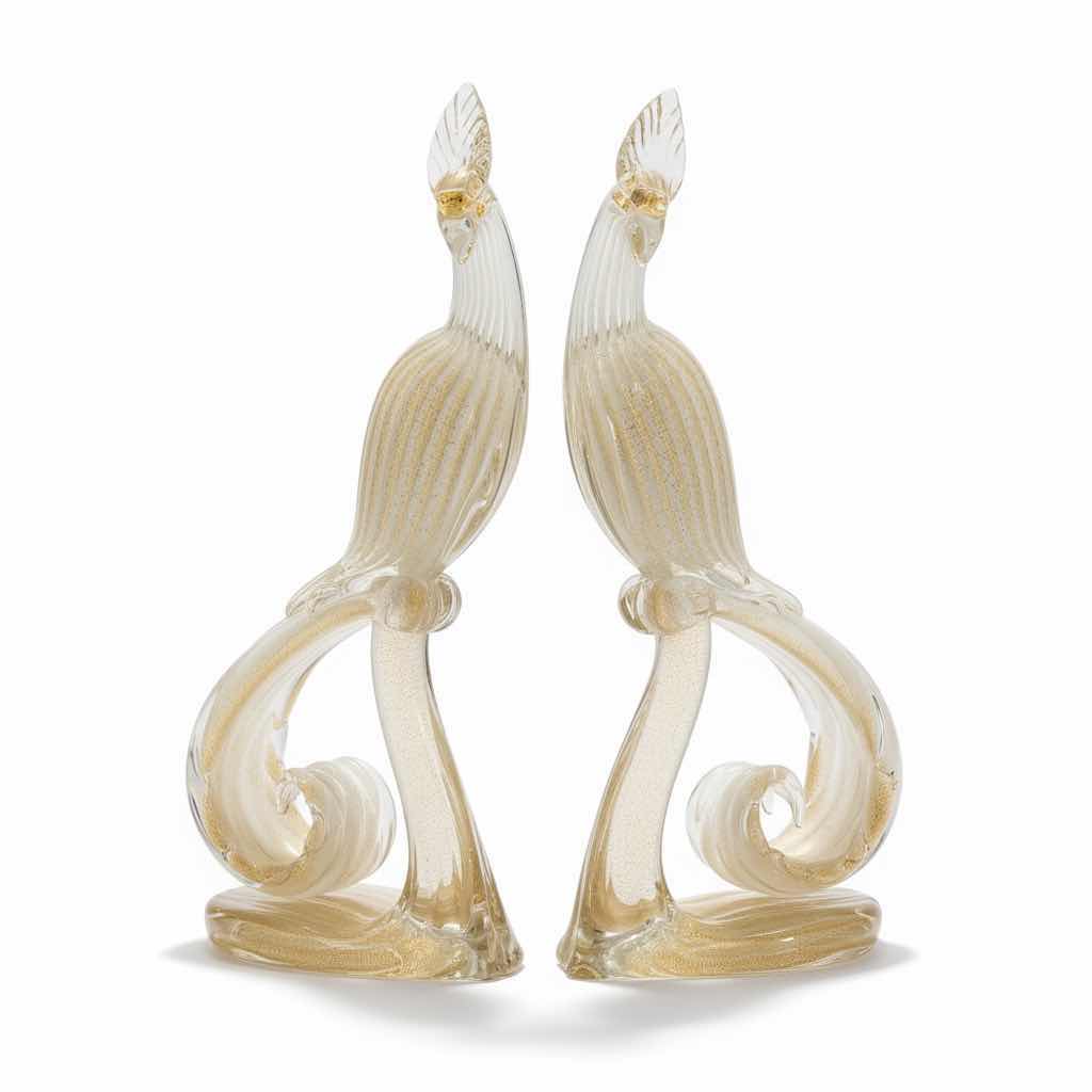 Photo 1 of PAIR OF MID-CENTURY MURANO HANDBLOWN GLASS BIRDS, ATTRIBUTED TO ALFREDO BARBINI.
• DESIGN: WHITE LATTIMO GLASS WITH 24 KT GOLD LEAF INCLUSIONS THROUGHOUT.
• MAKER: ATTRIBUTED TO RENOWNED MURANO GLASS ARTIST ALFREDO BARBINI.
• DIMENSIONS: APPROXIMATELY H1