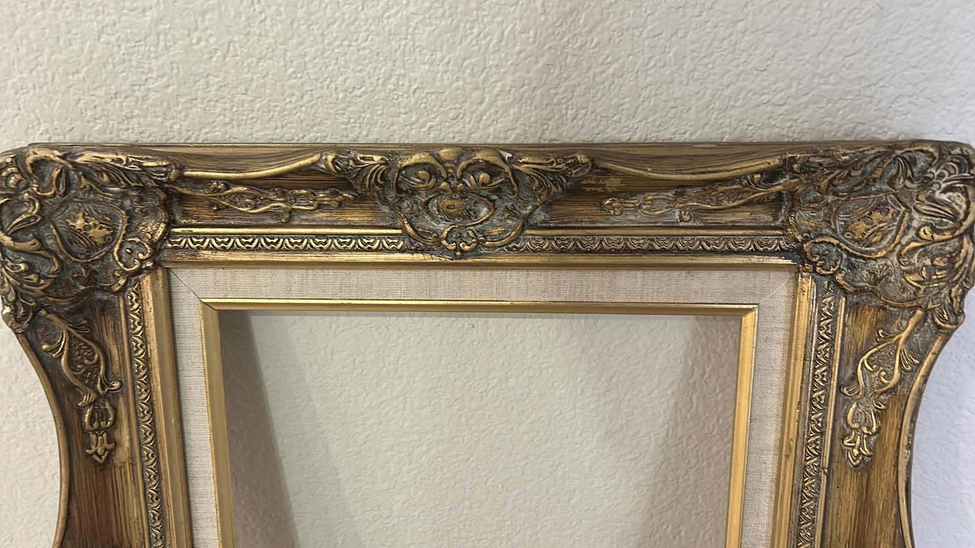 Photo 1 of ANTIQUE ORNATE WOOD GOLD PICTURE FRAME, FEATURING BAROQUE OR ROCOCO STYLE CARVINGS. 19” x H22 1/2”