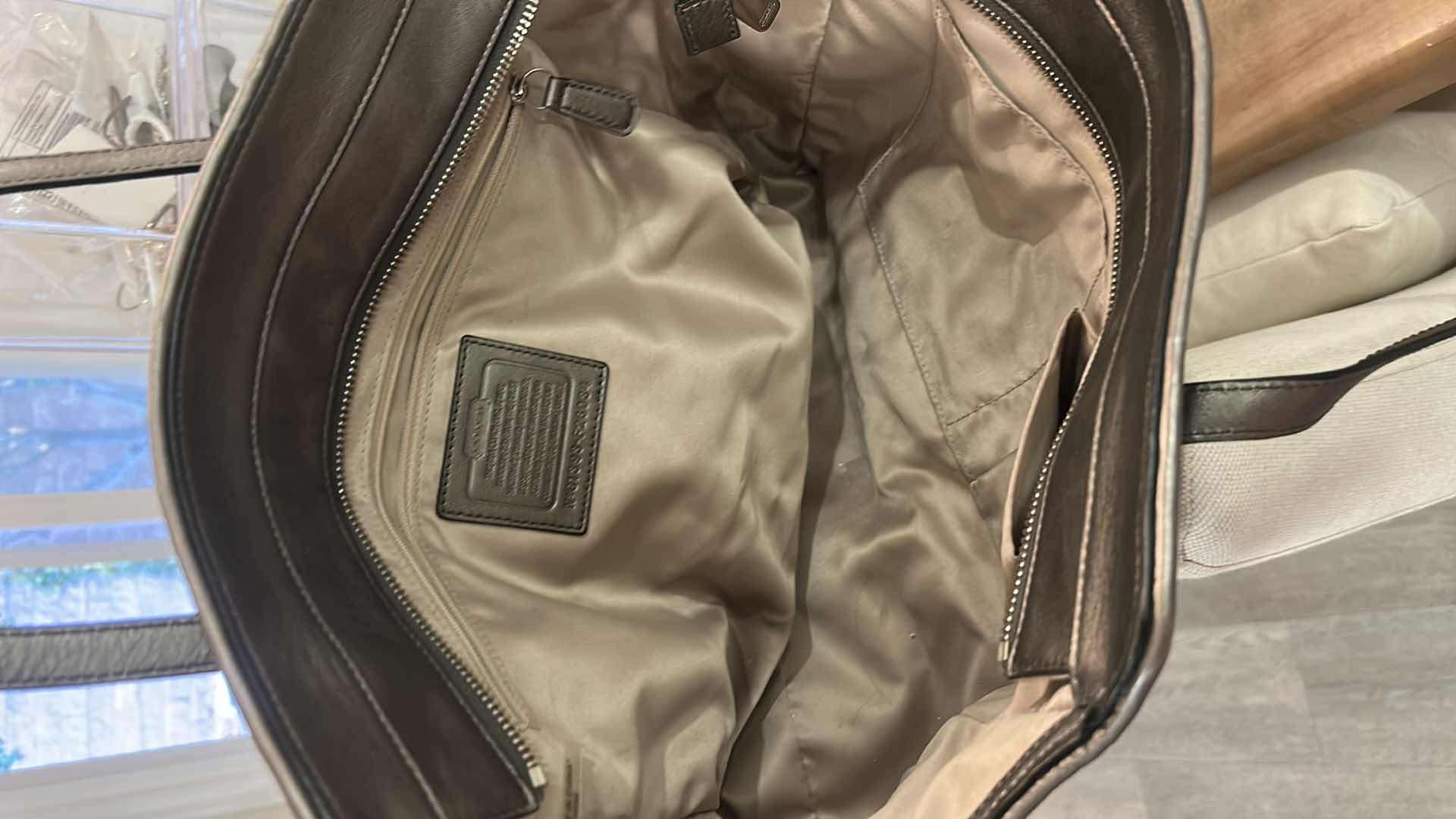 Photo 1 of COACH TAYLOR ALEXIS SNAKE PRINT CARRYALL SATCHEL HANDBAG (STYLE #F26034)
STATEMENT SATCHEL FEATURING A BOLD SNAKE PRINT FABRIC EXTERIOR WITH METALLIC LEATHER TRIM AND SILVER-TONE HARDWARE.