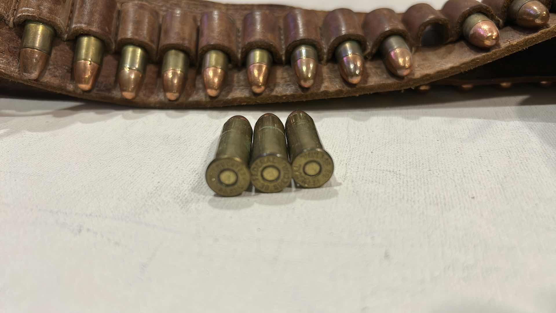 Photo 1 of ANTIQUE LEATHER BELT AND HOLSTER WITH FEDERAL 38 SPECIAL BULLETS