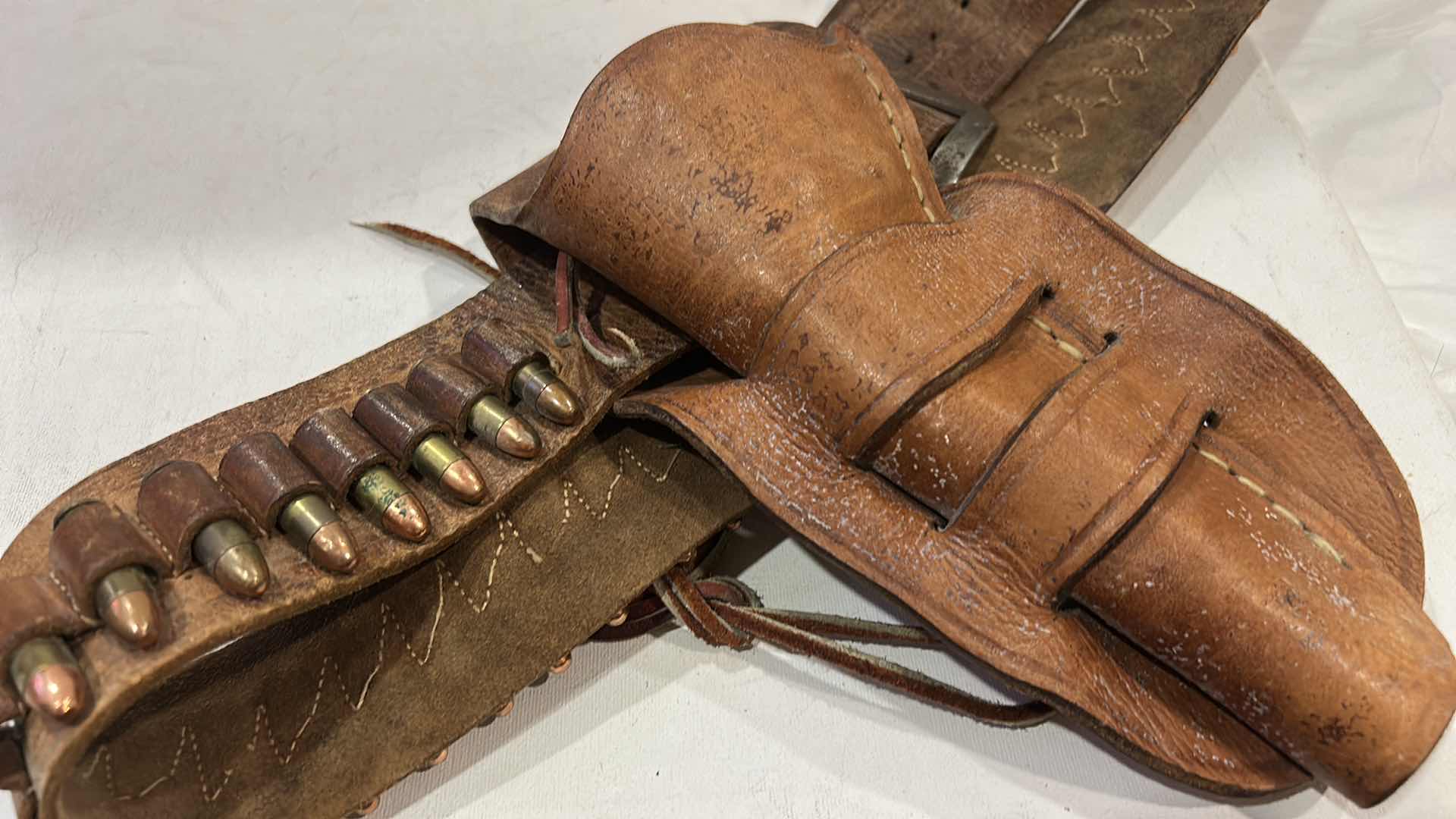 Photo 1 of ANTIQUE LEATHER BELT AND HOLSTER WITH FEDERAL 38 SPECIAL BULLETS