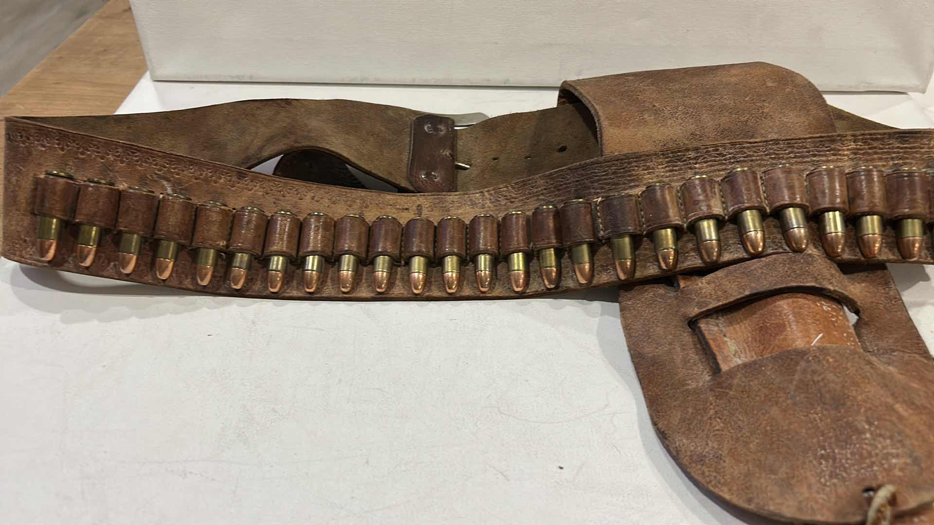 Photo 1 of ANTIQUE LEATHER BELT AND HOLSTER WITH FEDERAL 38 SPECIAL BULLETS