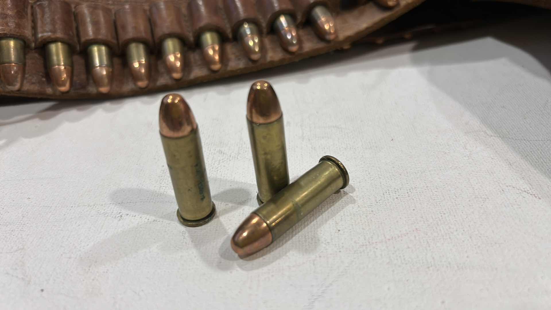 Photo 1 of ANTIQUE LEATHER BELT AND HOLSTER WITH FEDERAL 38 SPECIAL BULLETS