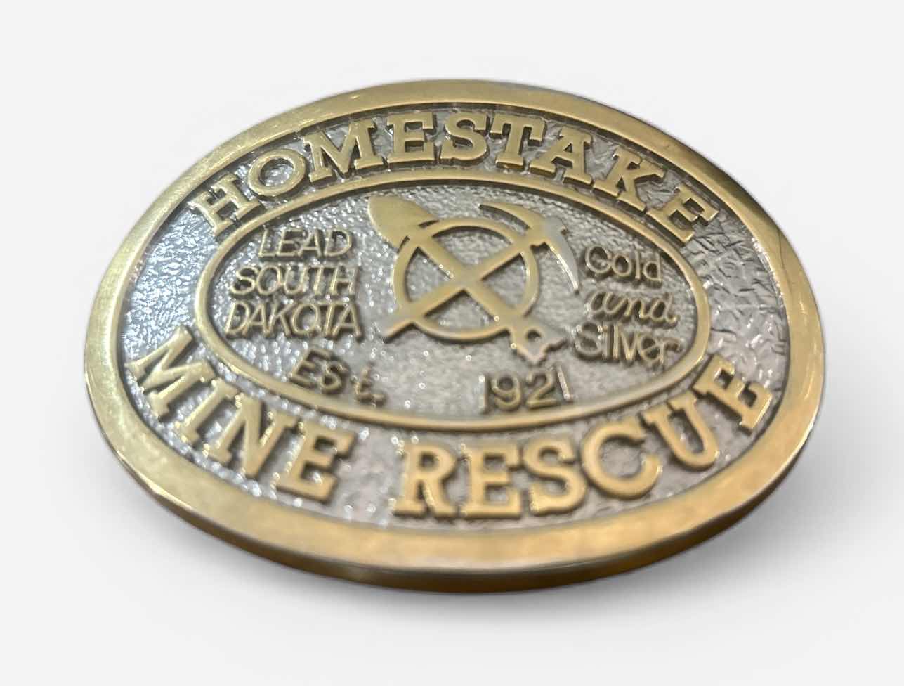 Photo 1 of COLLECTIBLE BELT BUCKLE COMMEMORATING THE HOMESTAKE MINE RESCUE TEAM IN LEAD, SOUTH DAKOTA, ESTABLISHED IN 1921.