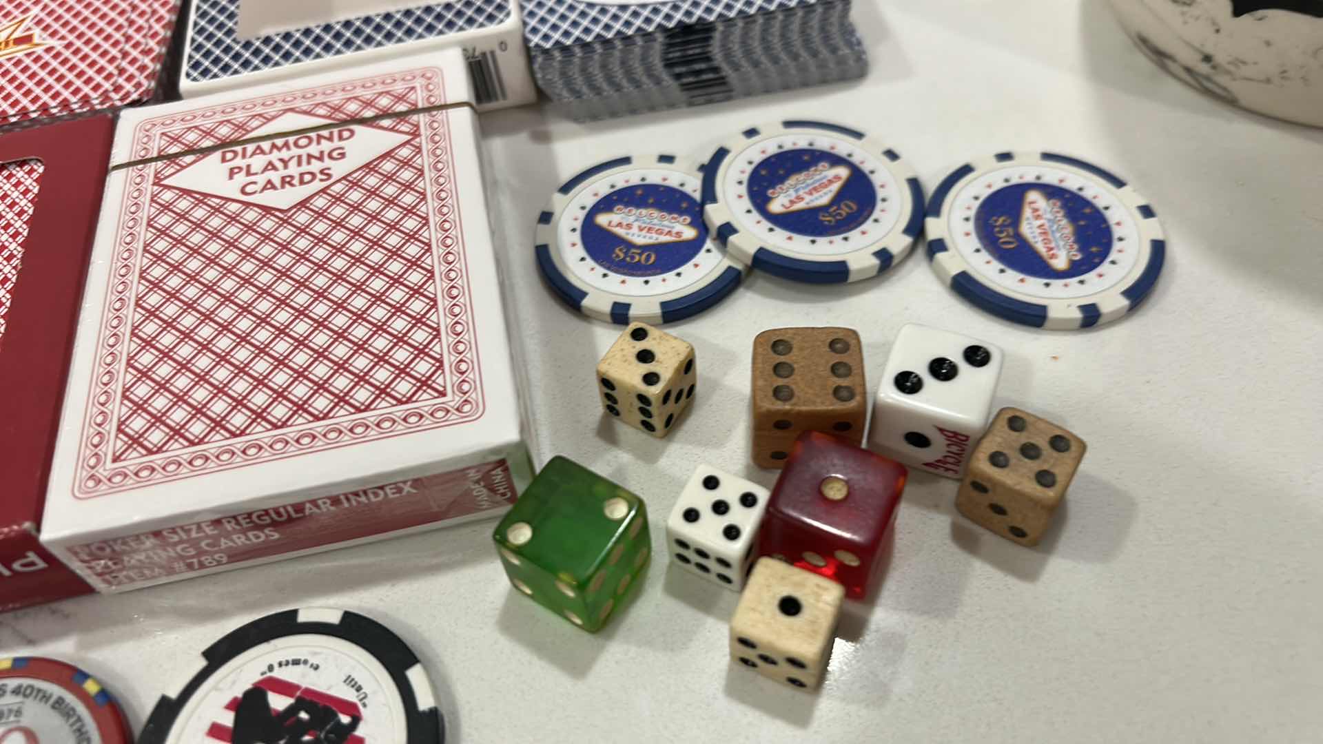 Photo 1 of LAS VEGAS CASINO PLAYING CARDS, DICE, 6 $50 REPLICA CHIPS AND 1 REAL CHIP, 1 COMMEMORATIVE TOKEN