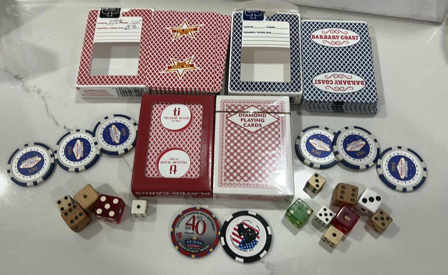Photo 1 of LAS VEGAS CASINO PLAYING CARDS, DICE, 6 $50 REPLICA CHIPS AND 1 REAL CHIP, 1 COMMEMORATIVE TOKEN