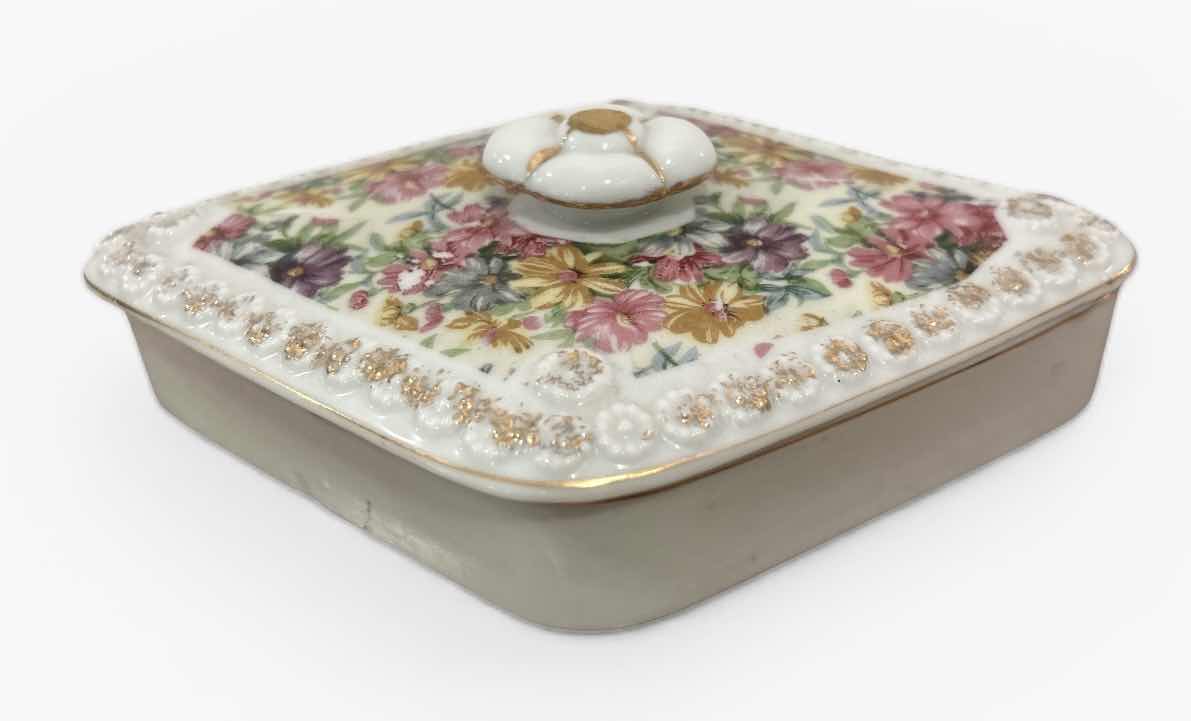 Photo 1 of VINTAGE DIAMOND-SHAPED PORCELAIN TRINKET BOX WITH FLORAL PATTERN ON LID.