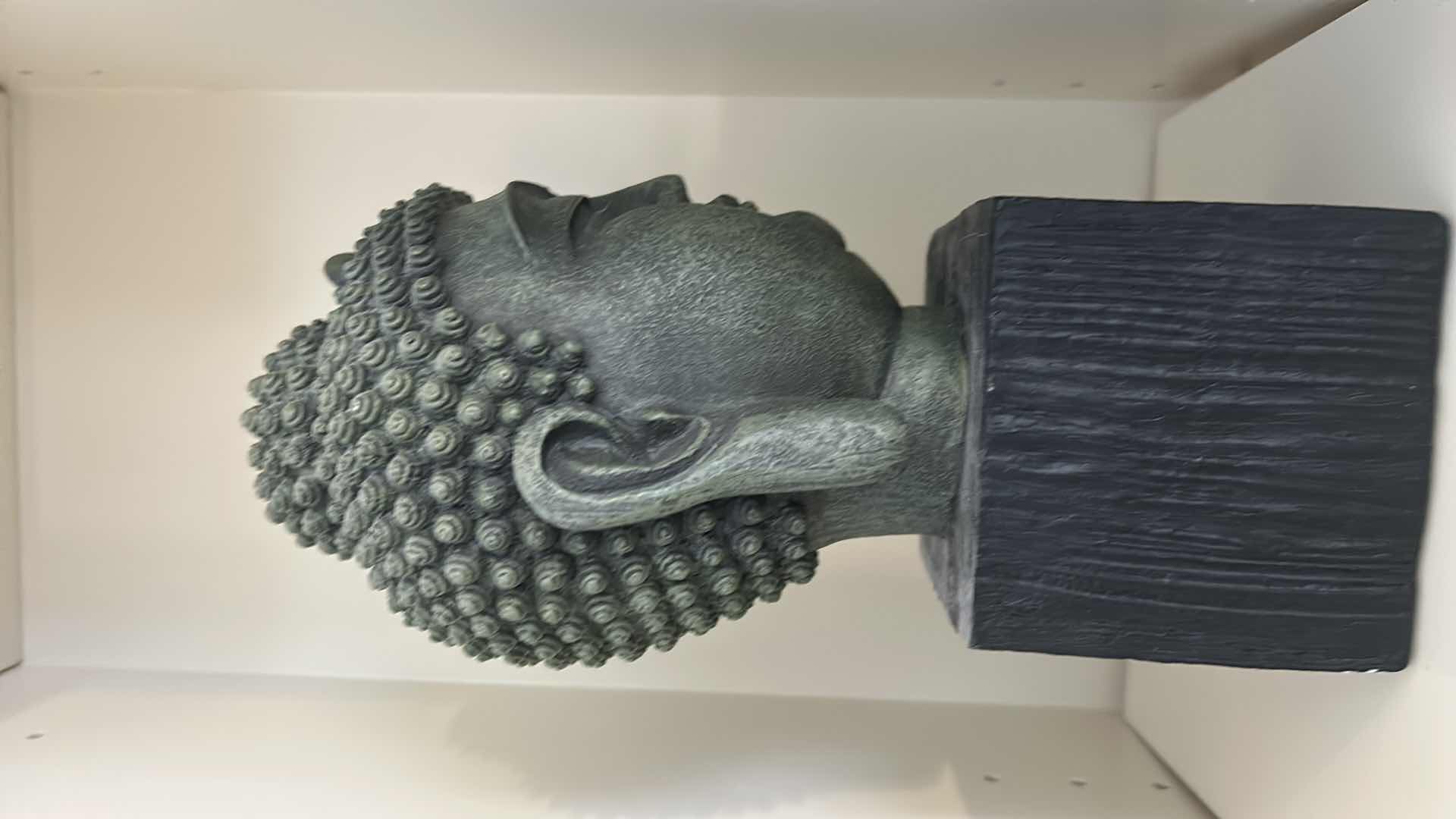 Photo 1 of DECORATIVE BUDDHA BUST FIGURINE MOUNTED ON A PEDESTAL BASE H11”.