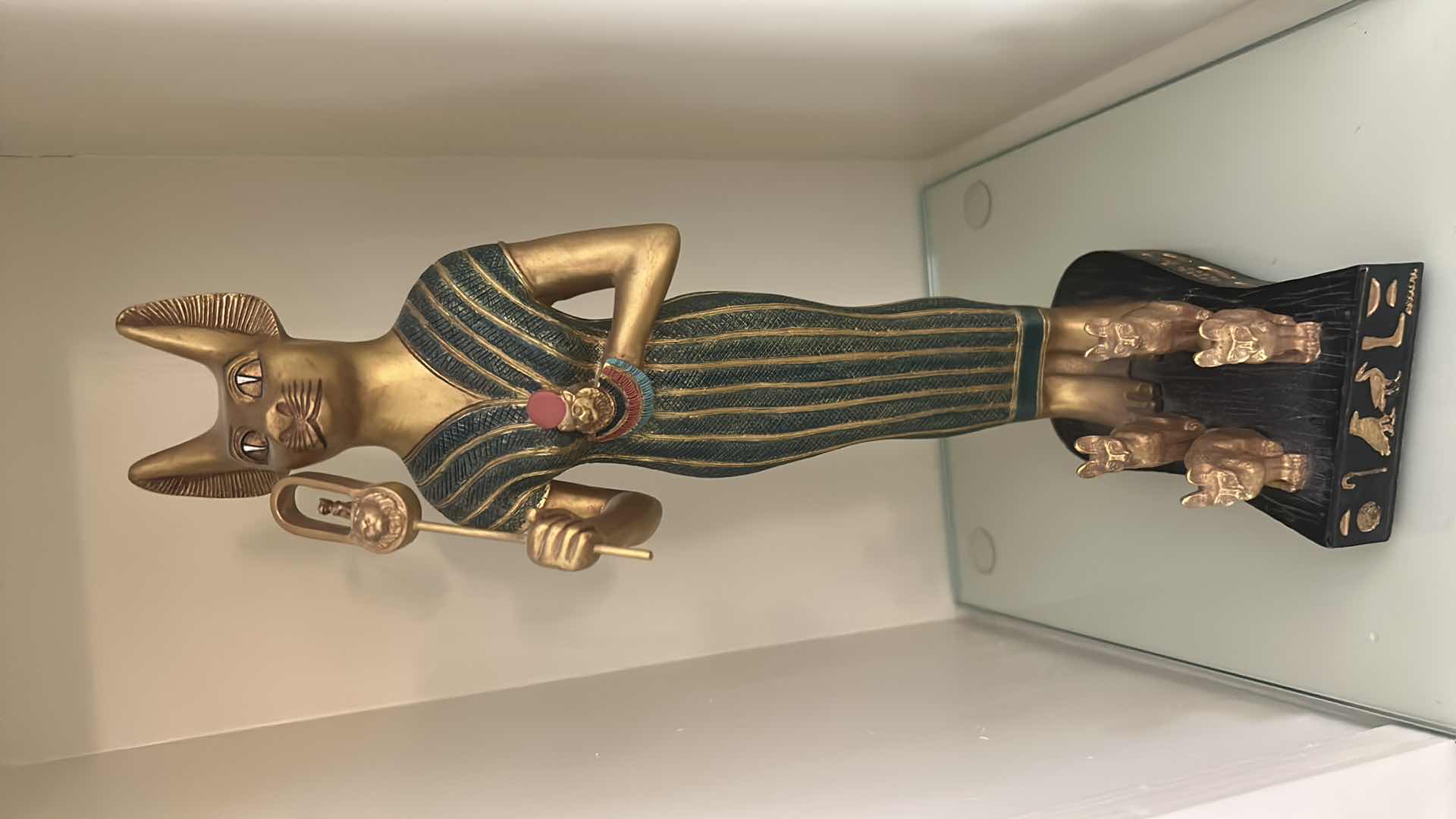 Photo 1 of CERAMIC DECORATIVE STATUE OF THE ANCIENT EGYPTIAN CAT GODDESS BASTET, OFTEN DEPICTED HOLDING A SISTRUM AND SURROUNDED BY SMALLER KITTENS. H13”