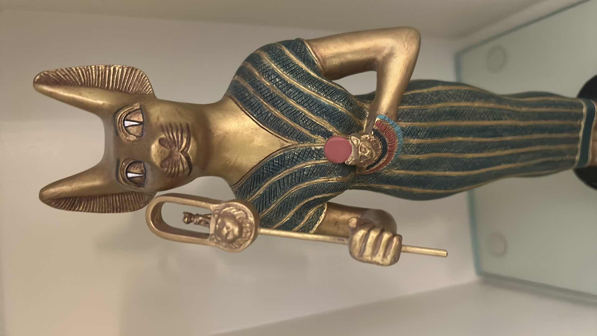 Photo 1 of CERAMIC DECORATIVE STATUE OF THE ANCIENT EGYPTIAN CAT GODDESS BASTET, OFTEN DEPICTED HOLDING A SISTRUM AND SURROUNDED BY SMALLER KITTENS. H13”