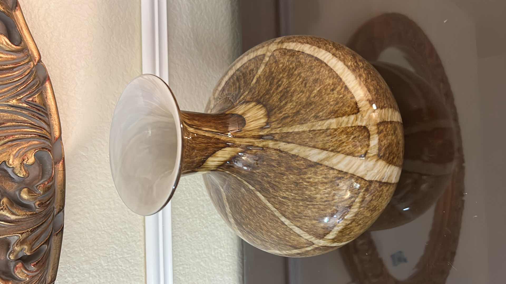 Photo 1 of DECORATIVE HAND-BLOWN ART GLASS VASE FEATURING A BROWN AND WHITE SWIRLED, SPECKLED PATTERN WITH A WIDE MOUTH. H12”