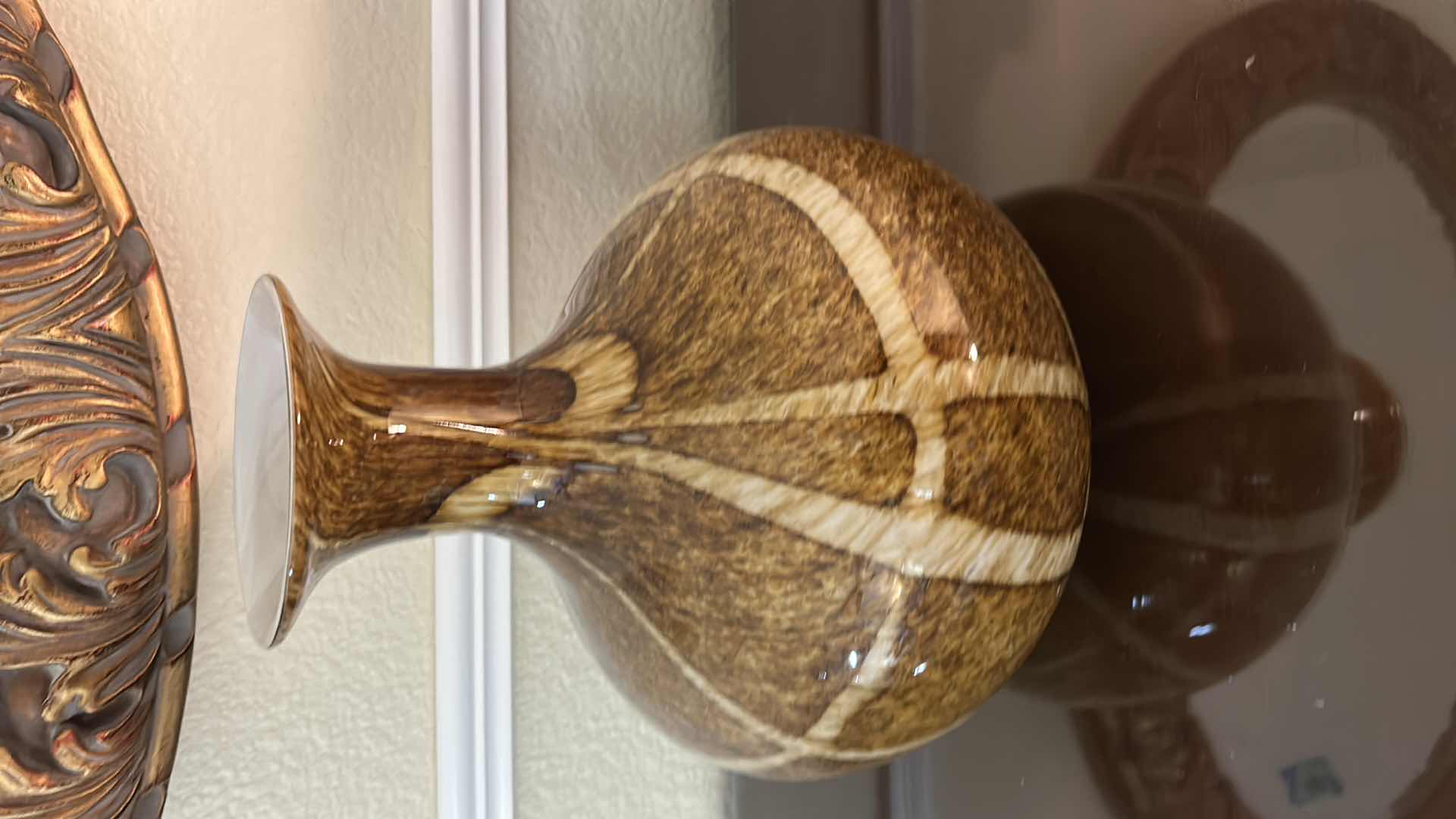 Photo 1 of DECORATIVE HAND-BLOWN ART GLASS VASE FEATURING A BROWN AND WHITE SWIRLED, SPECKLED PATTERN WITH A WIDE MOUTH. H12”