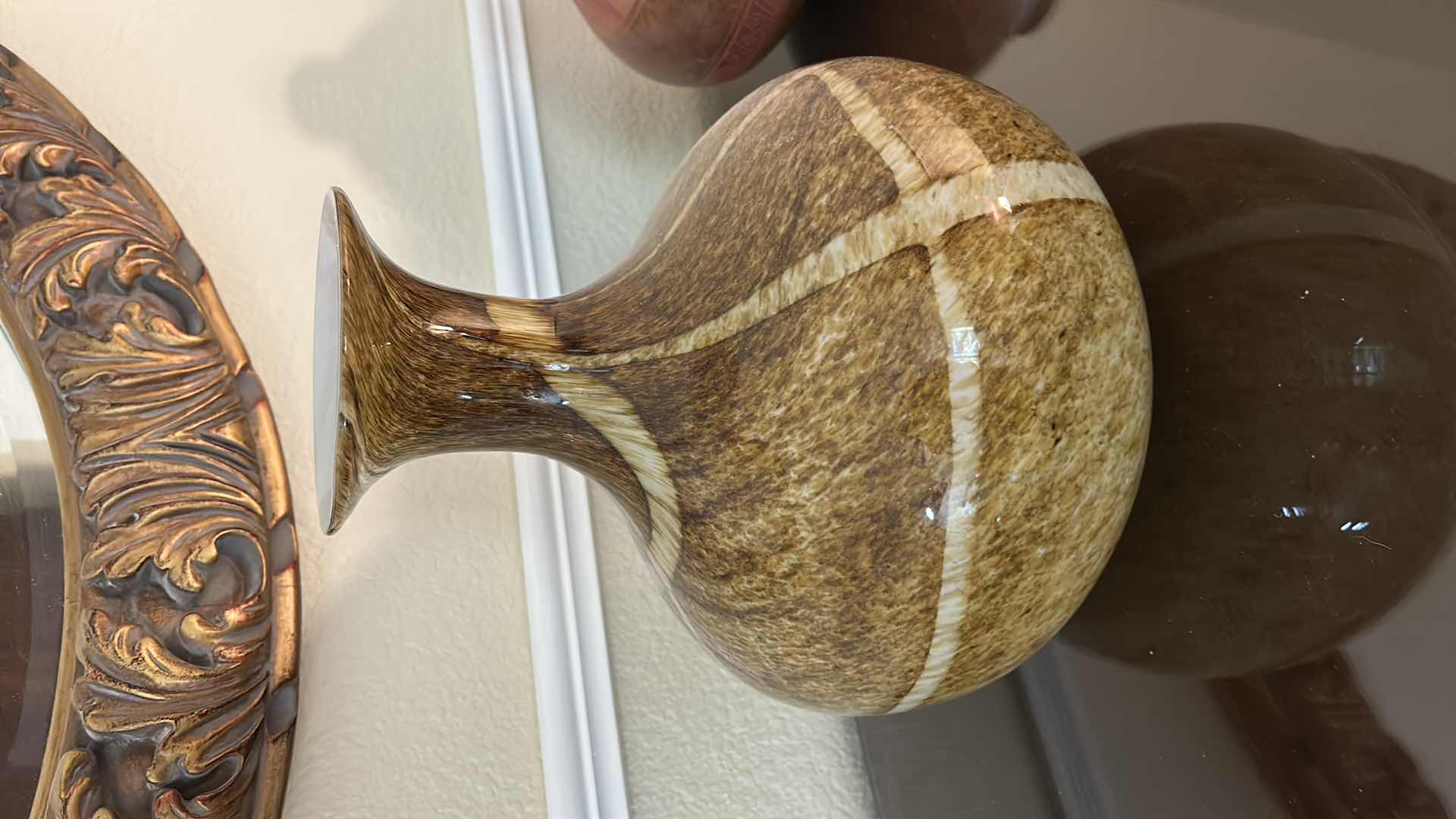 Photo 1 of DECORATIVE HAND-BLOWN ART GLASS VASE FEATURING A BROWN AND WHITE SWIRLED, SPECKLED PATTERN WITH A WIDE MOUTH. H12”