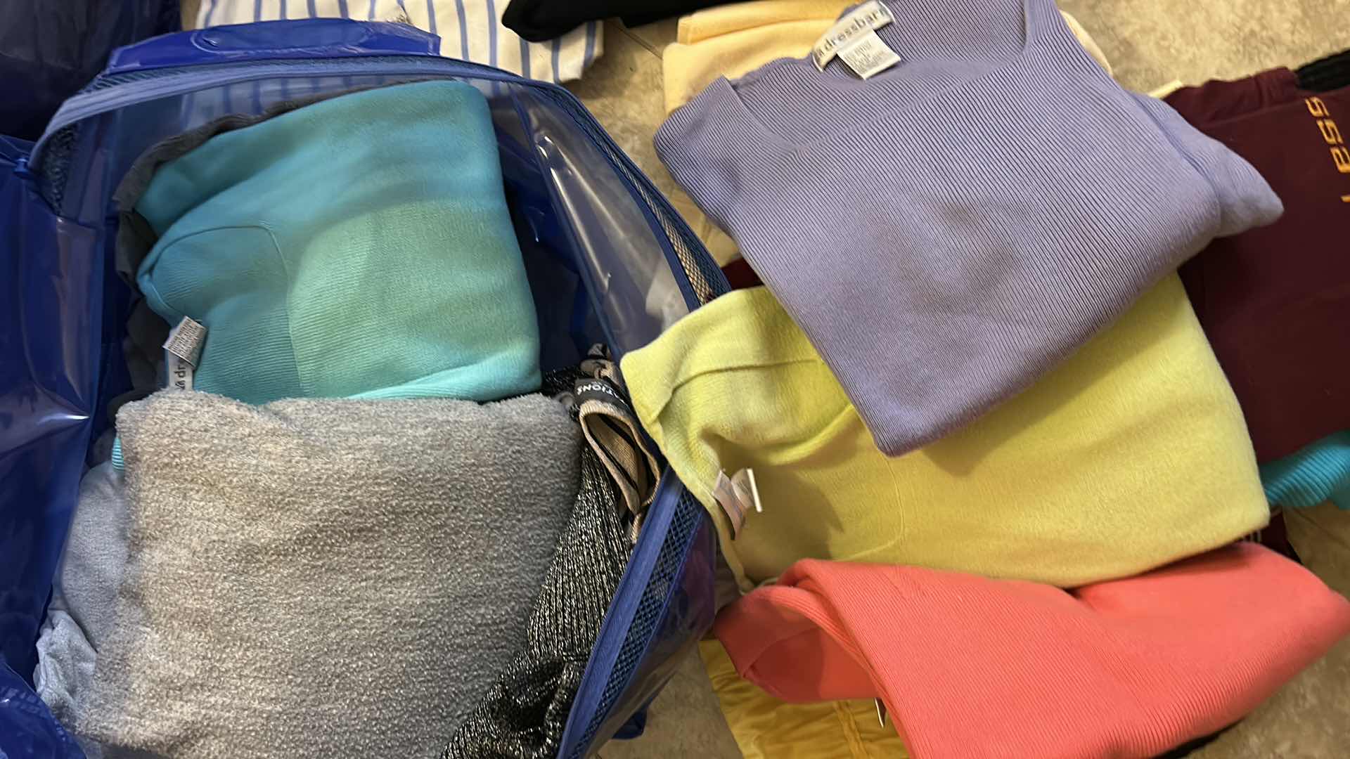 Photo 1 of 16 PAIRS WOMENS PANTS SIZE 12 AND BAG OF TOPS SIZE XL