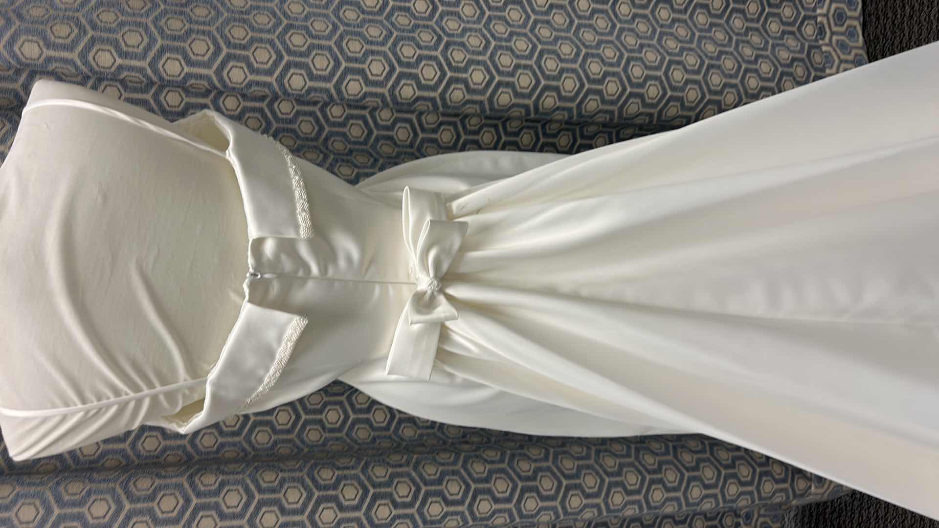 Photo 1 of BRIDAL GOWN, “PALOMA  BLANCO” SHEATH GOWN WITH OPTIONAL SPAGHETTI STRAP CRYSTAL BEADING ON THE TOP, DETACHABLE TRAIN IN IVORY, SIZE 8.