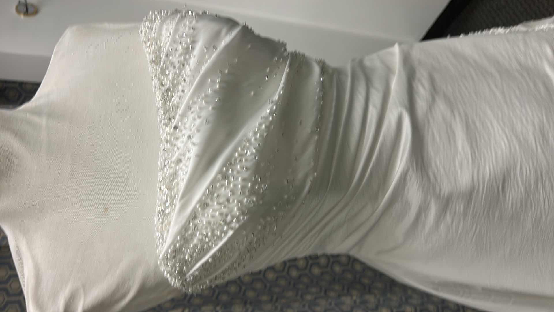 Photo 1 of BRIDAL GOWN BY MAGGIE SOTERO, ONE-PIECE STRAPLESS A-LINE SILHOUETTE WITH CORSET, SWAROVSKI CRYSTALS, PEARLS, AND SEED BEADS IN THE SHADE WHITE DIAMOND, SIZE 6. 