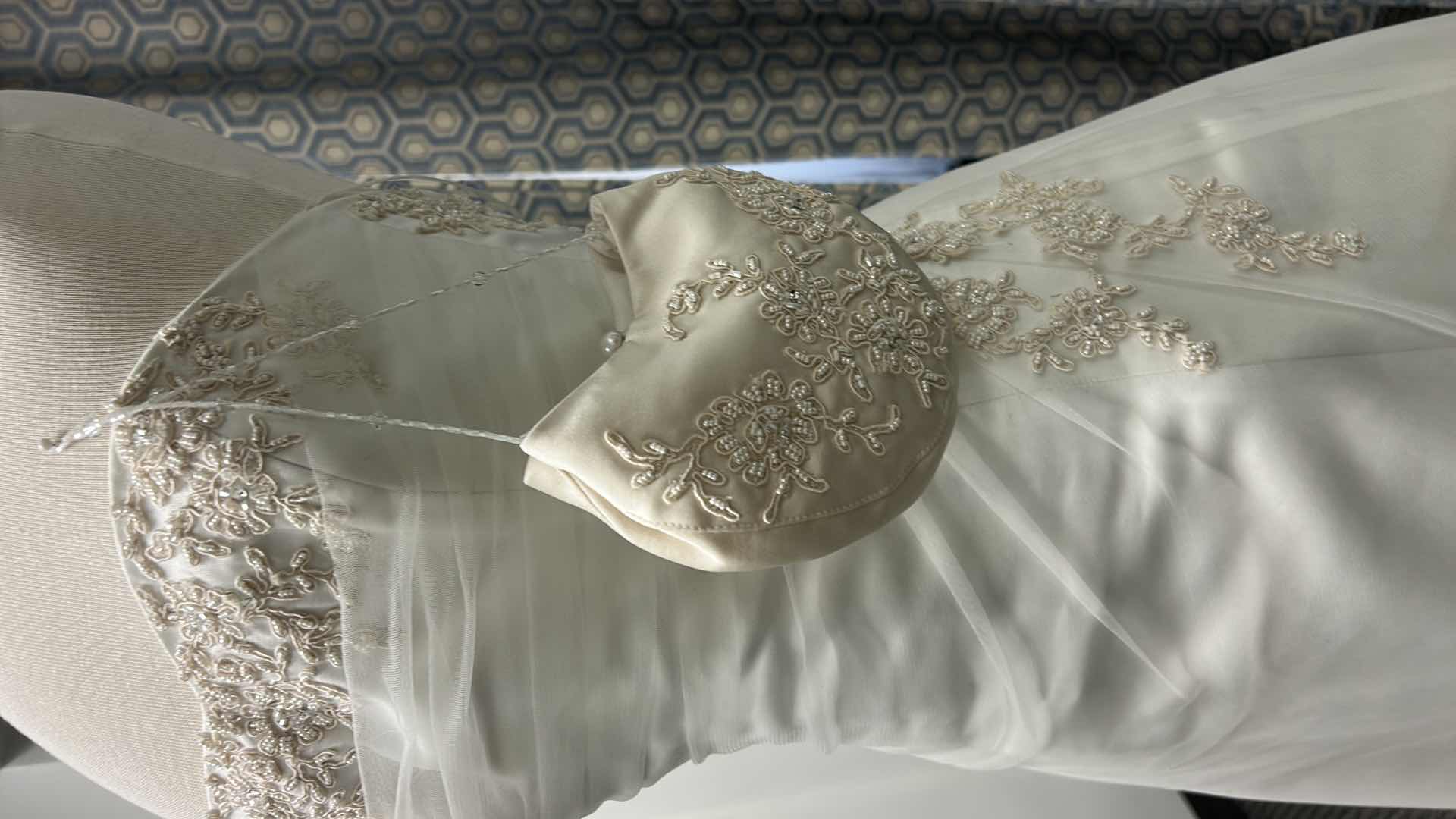 Photo 1 of BRIDAL GOWN, MAGGIE SOTTERO, ONE-PIECE A-LINE STRAPLESS WEDDING GOWN WITH COVERED BUTTONS OVER INNER CLOSURE, TULLE OVERLAY WITH DELICATE LACE, DIAMOND WHITE/CHAMPAGNE, SIZE 8/10, 