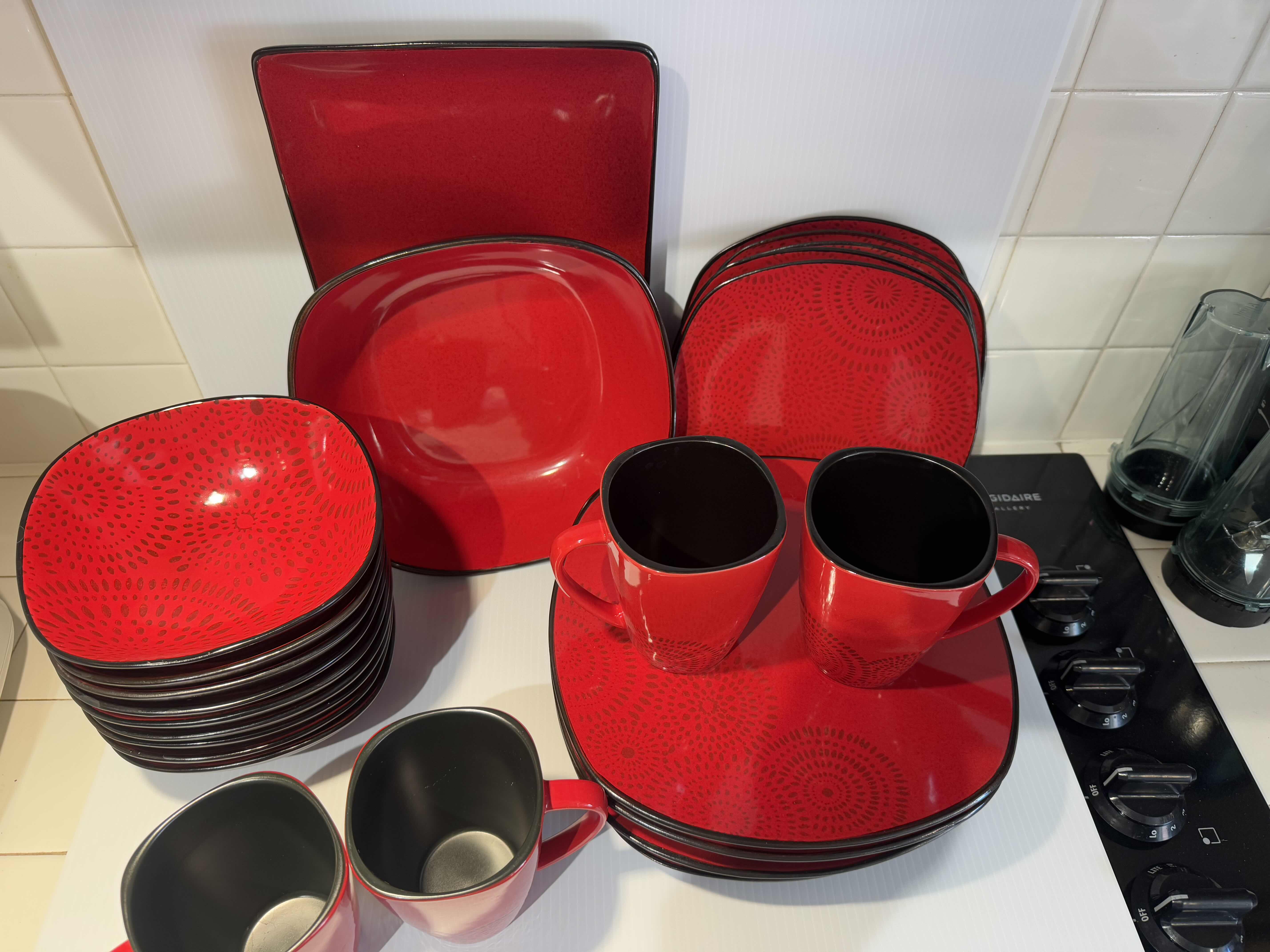 Photo 1 of 26 PIECE DINNER DISHES SET. RED AND BLACK DESIGNS. SOUP BOWLS, BREAD PLATES, COFFEE MUGS.