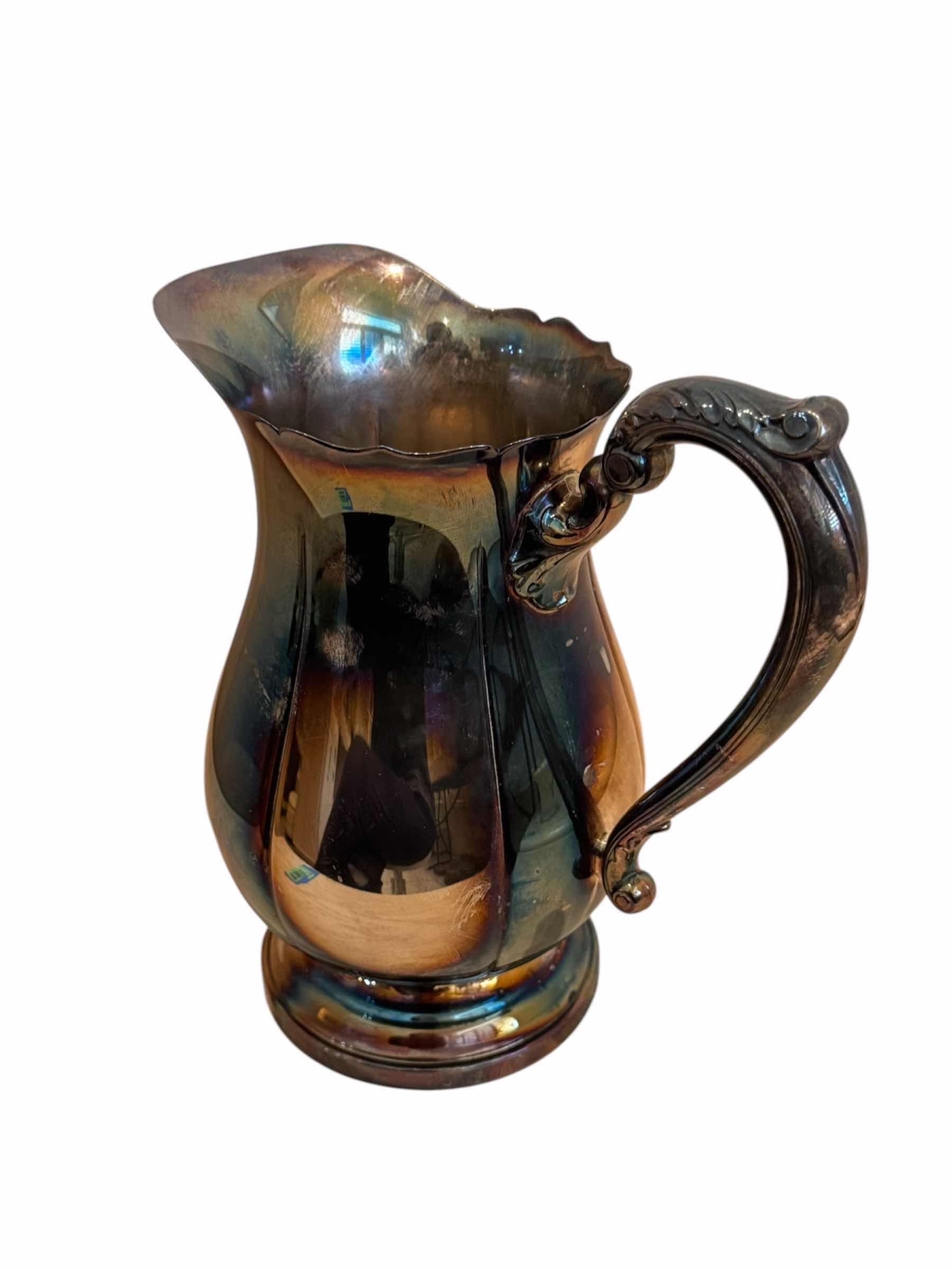 Photo 1 of VINTAGE ANTIQUE SILVER PITCHER 

8” X H9”
