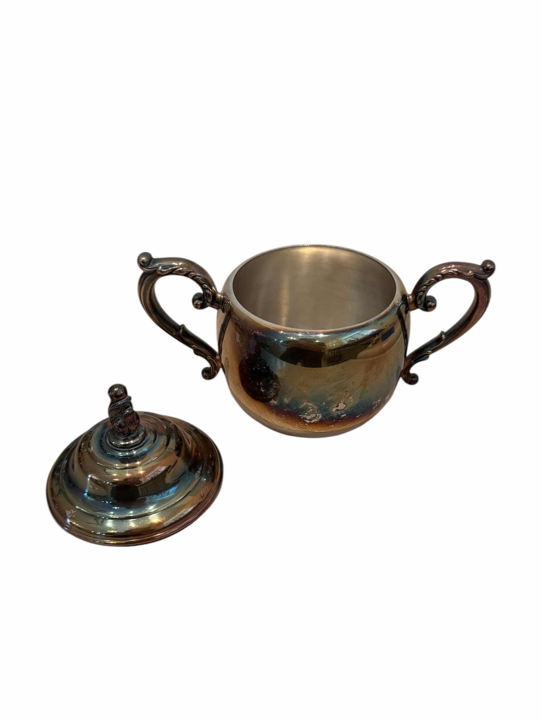 Photo 1 of VINTAGE ANTIQUE SILVER PLATED TEA SET, WM A. ROGERS 

TEA POT - 10” X H9.5”,

CREAMER - 5” X H2.5”,

SUGAR BOWL - 5.5” X H4”