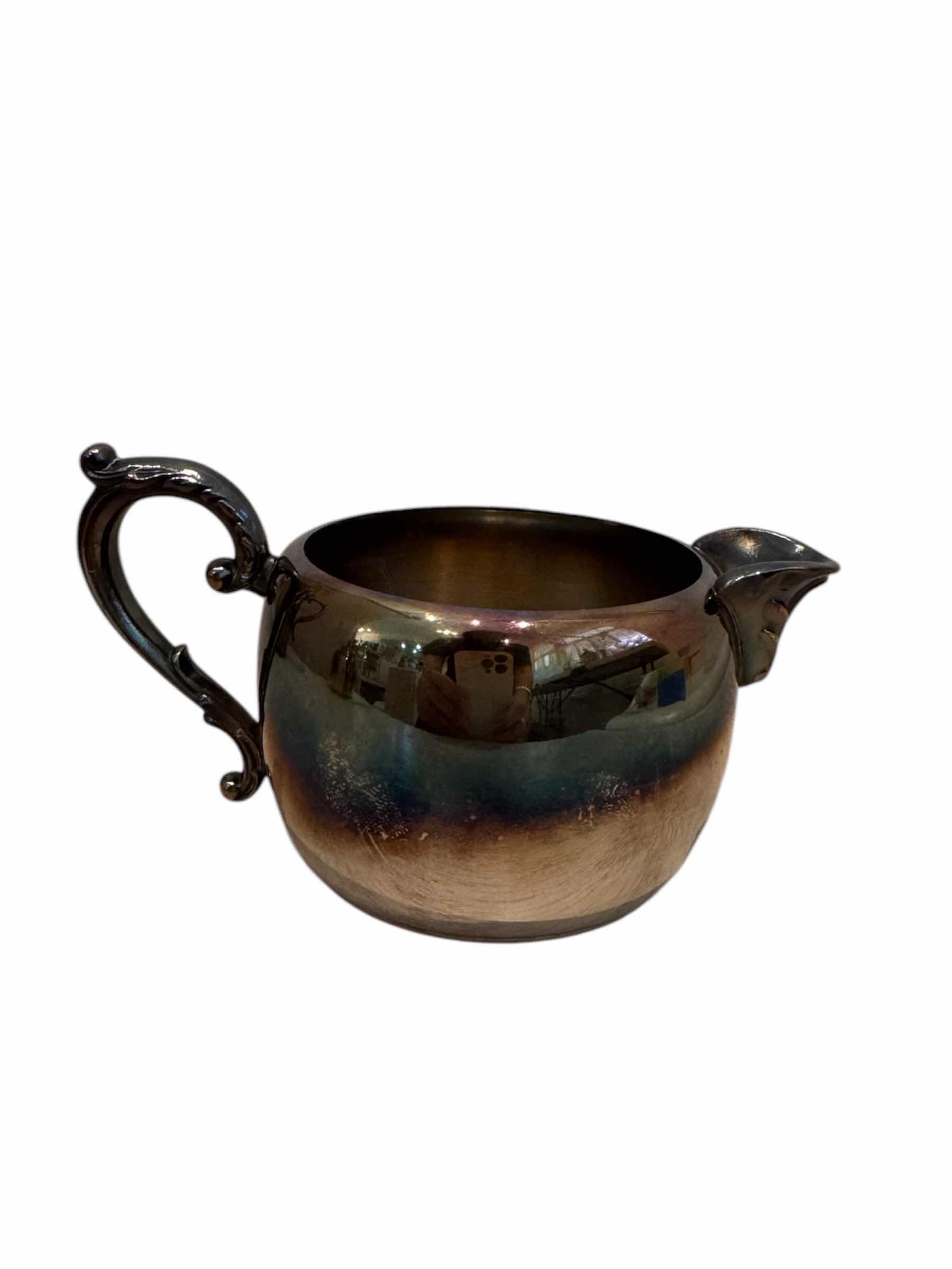 Photo 1 of VINTAGE ANTIQUE SILVER PLATED TEA SET, WM A. ROGERS 

TEA POT - 10” X H9.5”,

CREAMER - 5” X H2.5”,

SUGAR BOWL - 5.5” X H4”