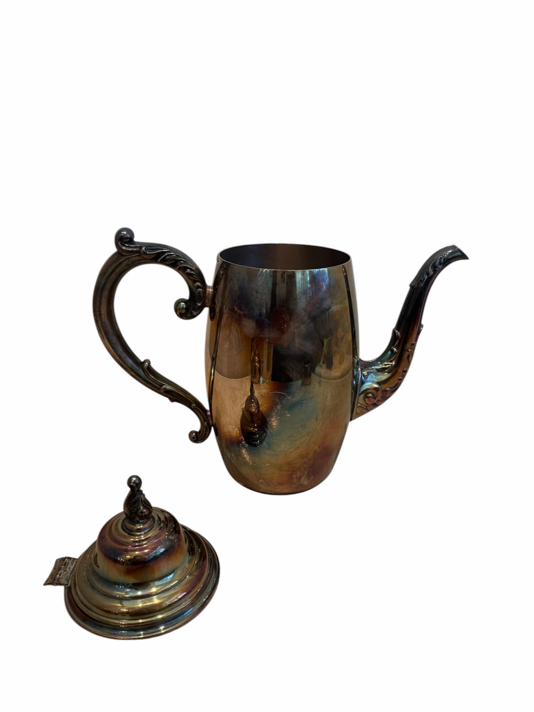 Photo 1 of VINTAGE ANTIQUE SILVER PLATED TEA SET, WM A. ROGERS 

TEA POT - 10” X H9.5”,

CREAMER - 5” X H2.5”,

SUGAR BOWL - 5.5” X H4”
