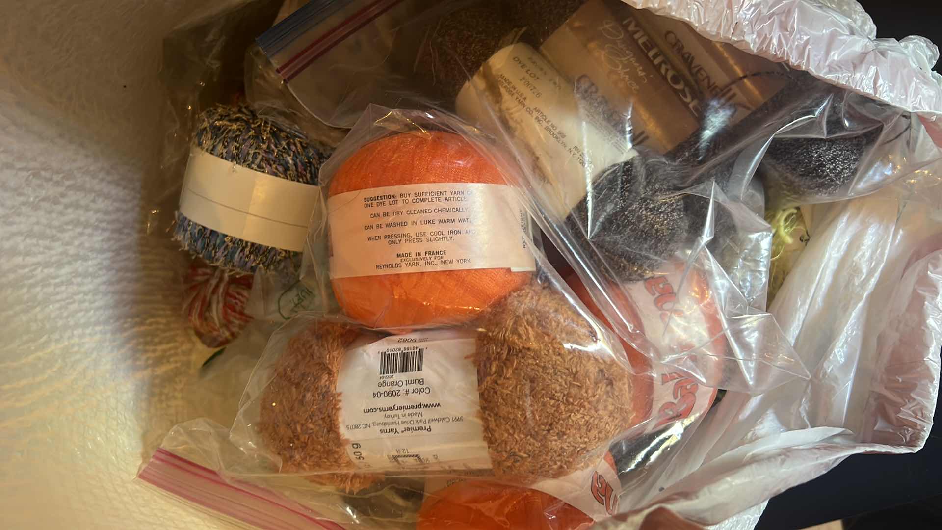 Photo 1 of CONTENTS OF BAG: YARN IN ASSORTMENT OF COLORS