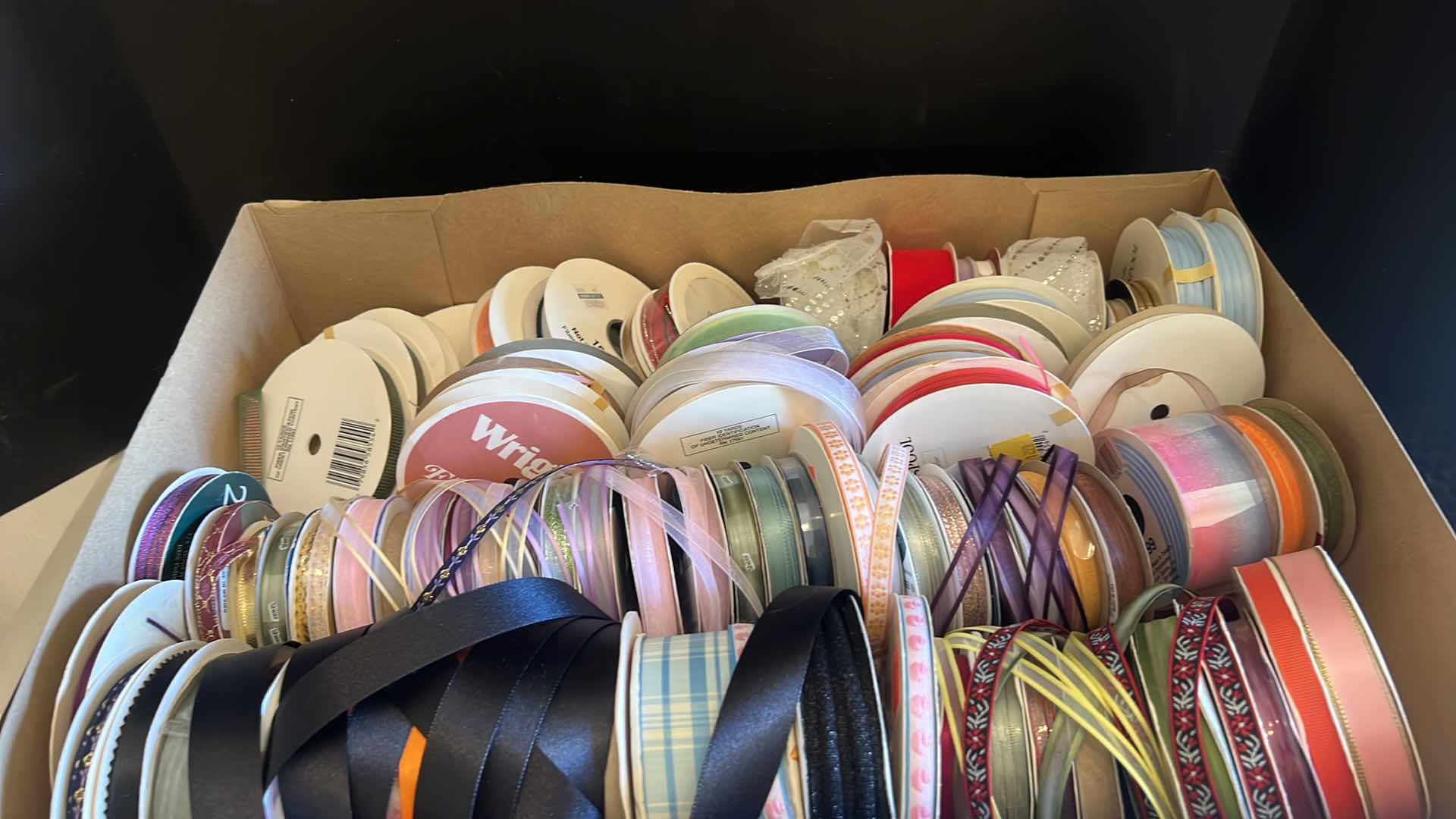 Photo 1 of TWO BOXES OF RIBBON VARIOUS COLORS