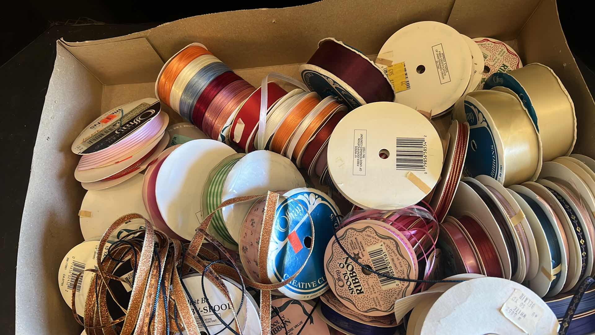 Photo 1 of TWO BOXES OF RIBBON VARIOUS COLORS