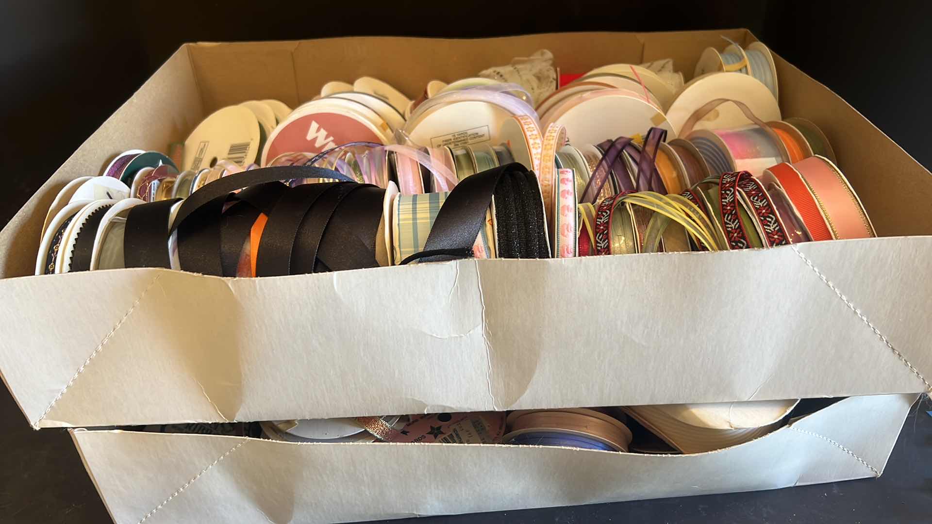 Photo 1 of TWO BOXES OF RIBBON VARIOUS COLORS