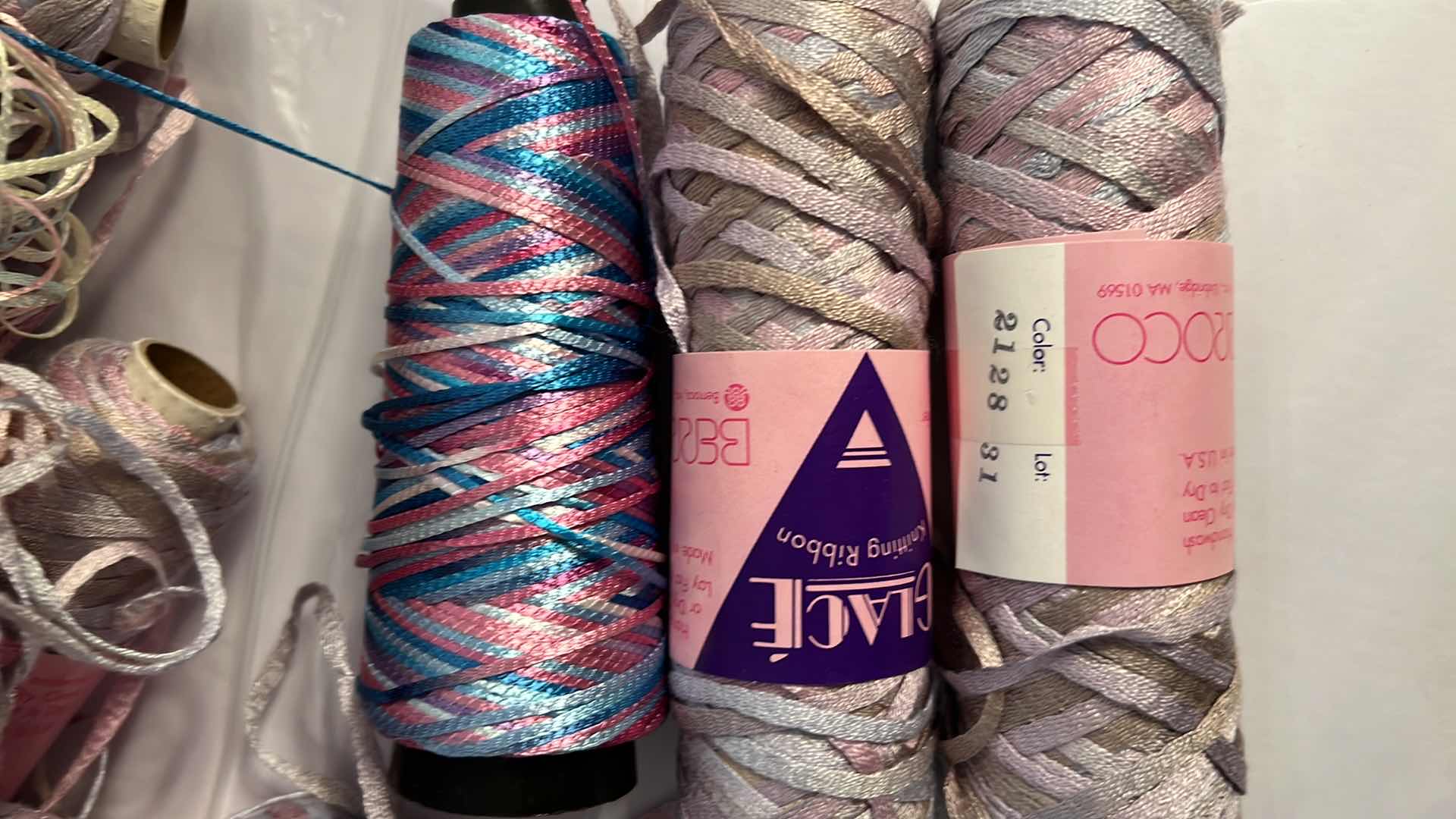 Photo 1 of BAG OF BOBBINS AND SKEINS OF KNITTING RIBBON AND THREAD