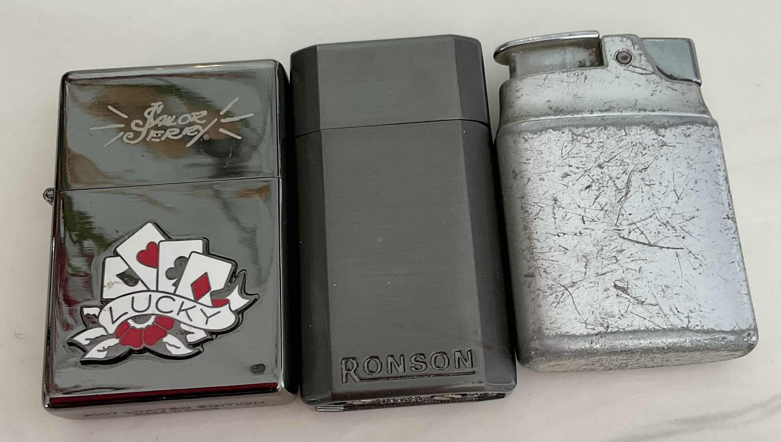 Photo 1 of ASSORTED LIGHTERS 2 ZIPPO LIGHTERS AND 1 TORCH LIGHTER