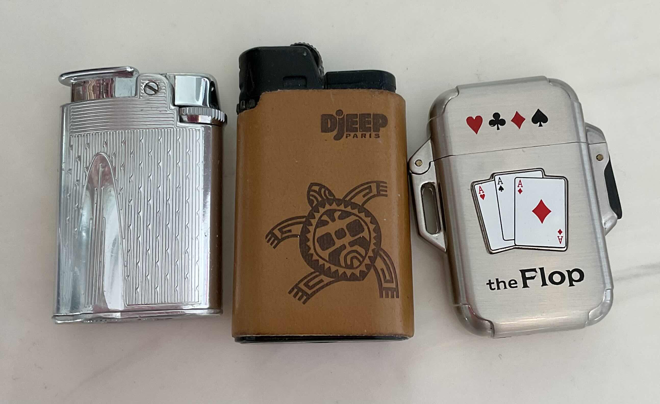 Photo 1 of ASSORTED LIGHTERS 2 TORCH LIGHTERS AND 1 STRIKE LIGHTER