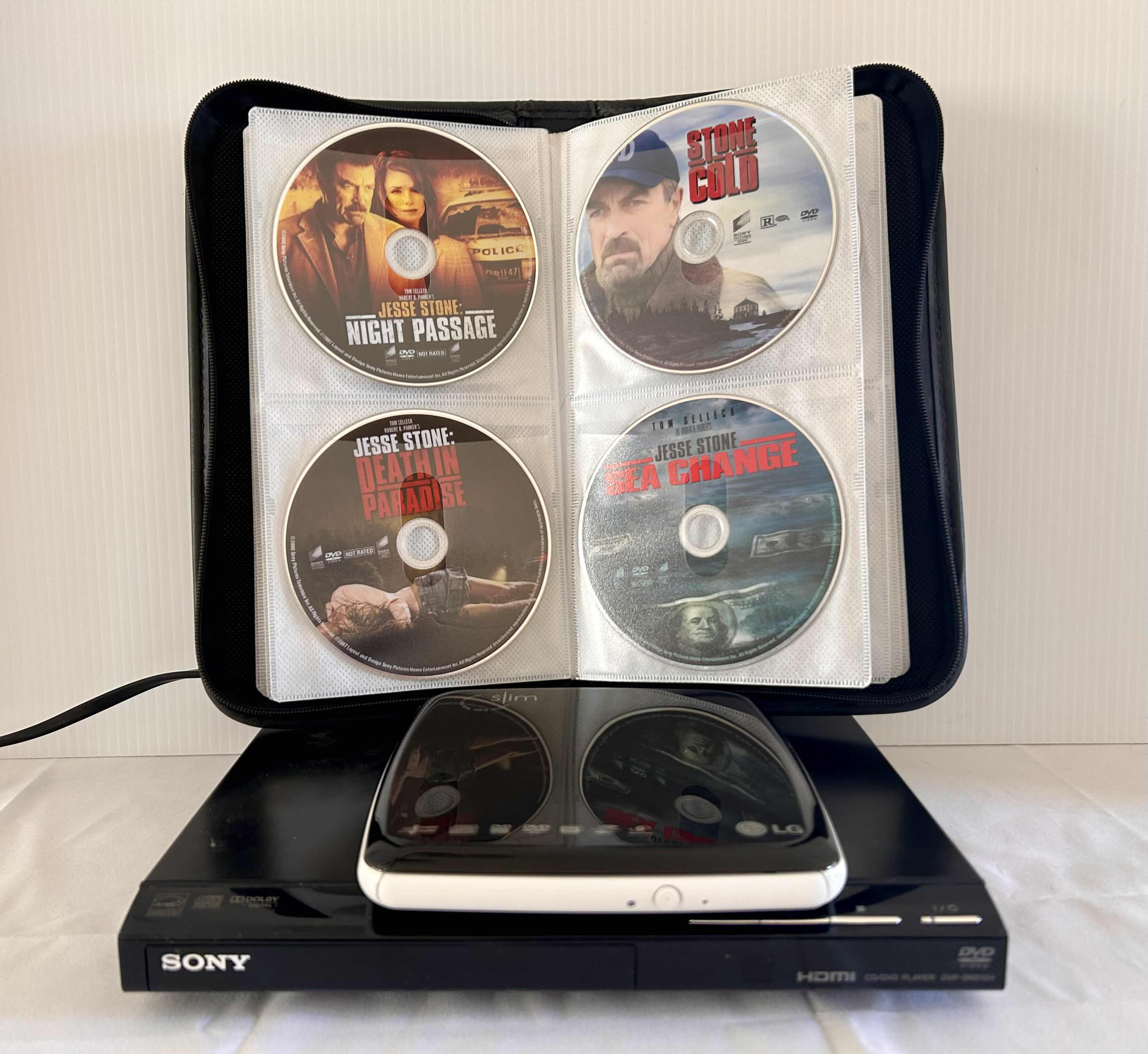 Photo 1 of 2- DVD PLAYERS- WITH REMOTE, LG  AND SONY WITH VARIOUS  DVD'S IN CASE.