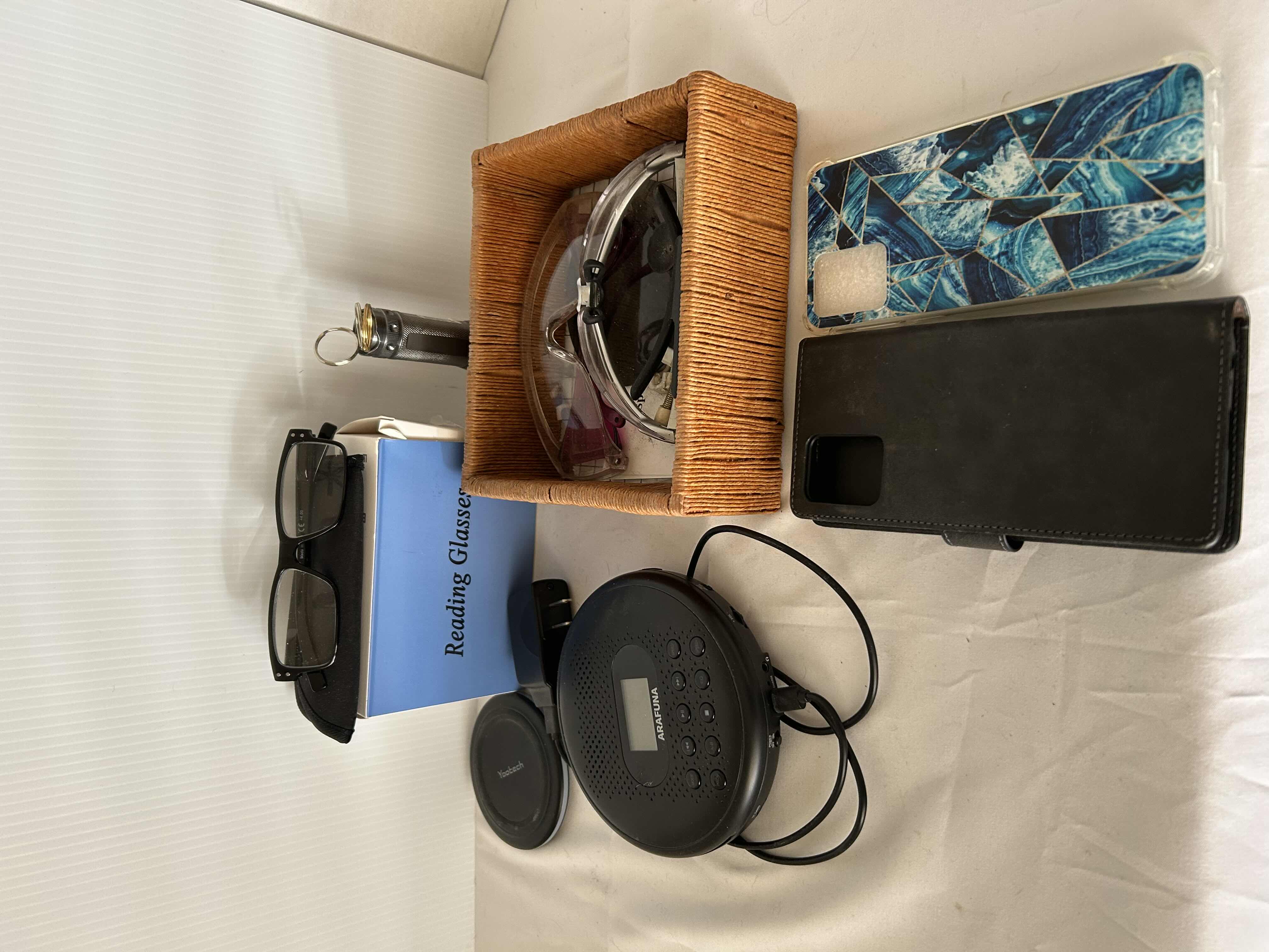 Photo 1 of ASSORTED ITEMS,READING GLASSES, PORTABLE CD PLAYER, IPHONE CASES.