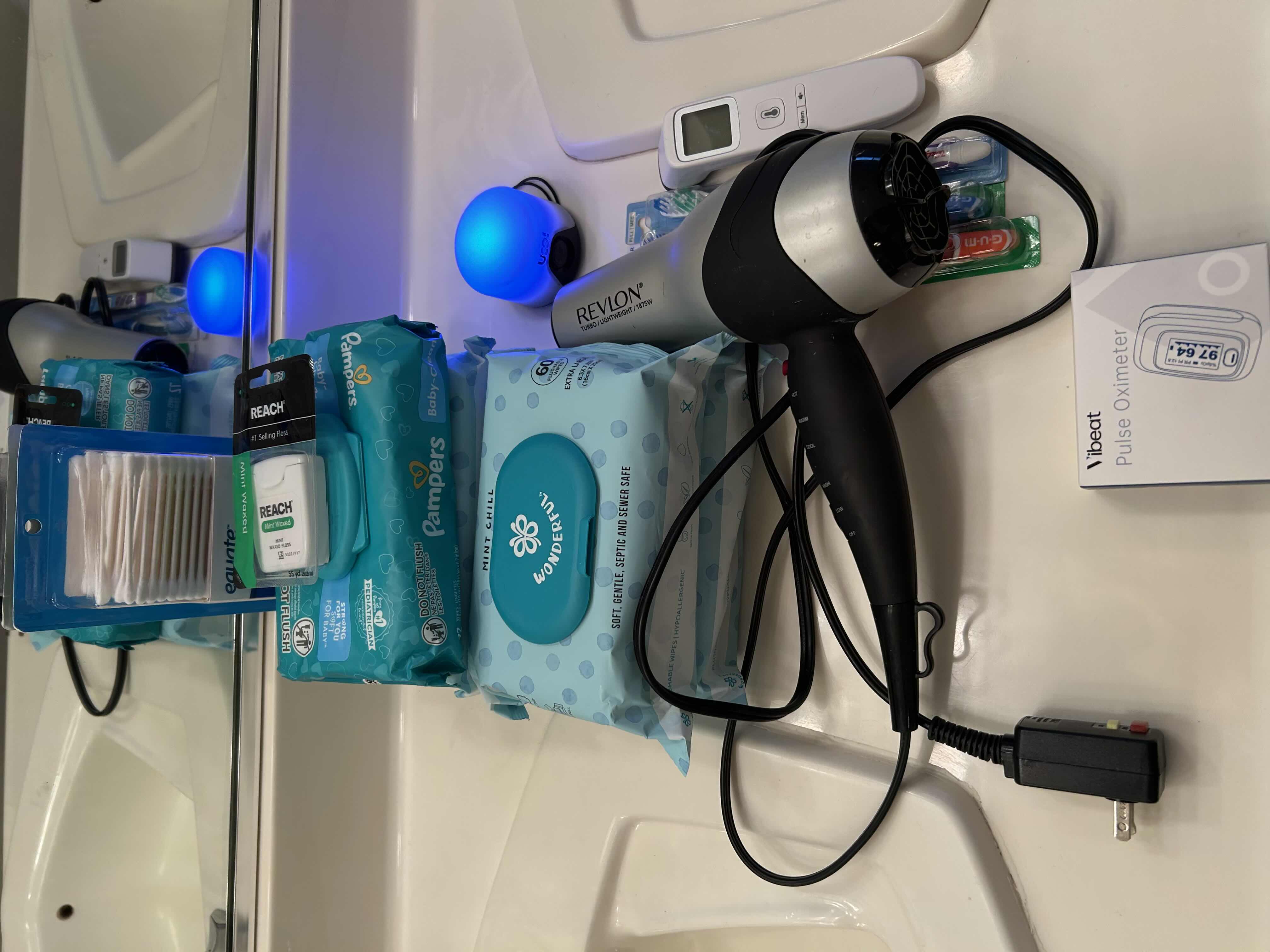 Photo 1 of BATHROOM SUNDRIES.REVLON HAIRDRYER, DIGITAL THERMOMETER, PULSEOXIMETER, BRAND NEW-BABY WIPES, DENTAL FLOSS, TOOTHBRUSHES.