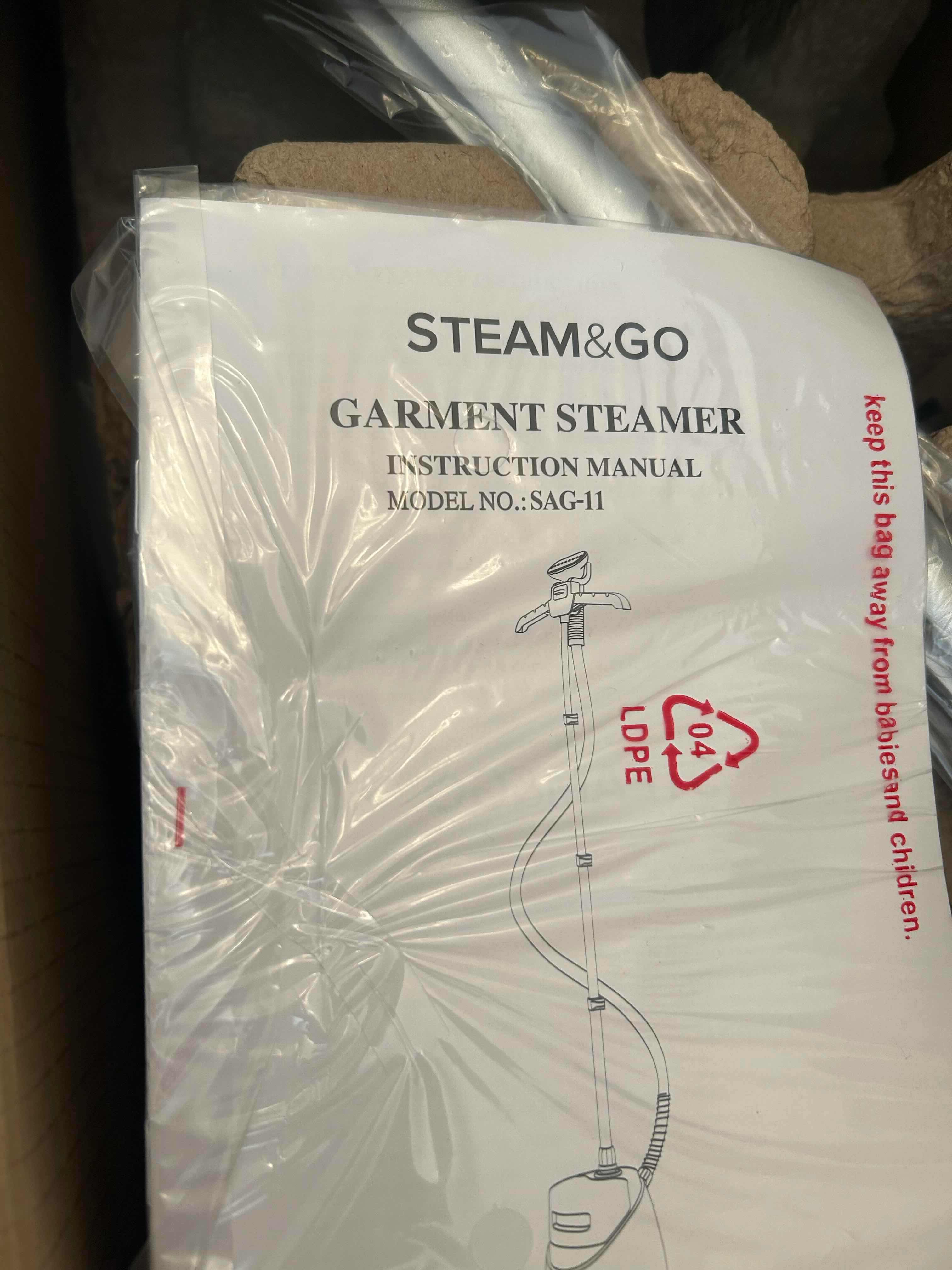 Photo 1 of BRAND NEW-STEAM & GO GARMENT STEAMER. MODEL SAG11