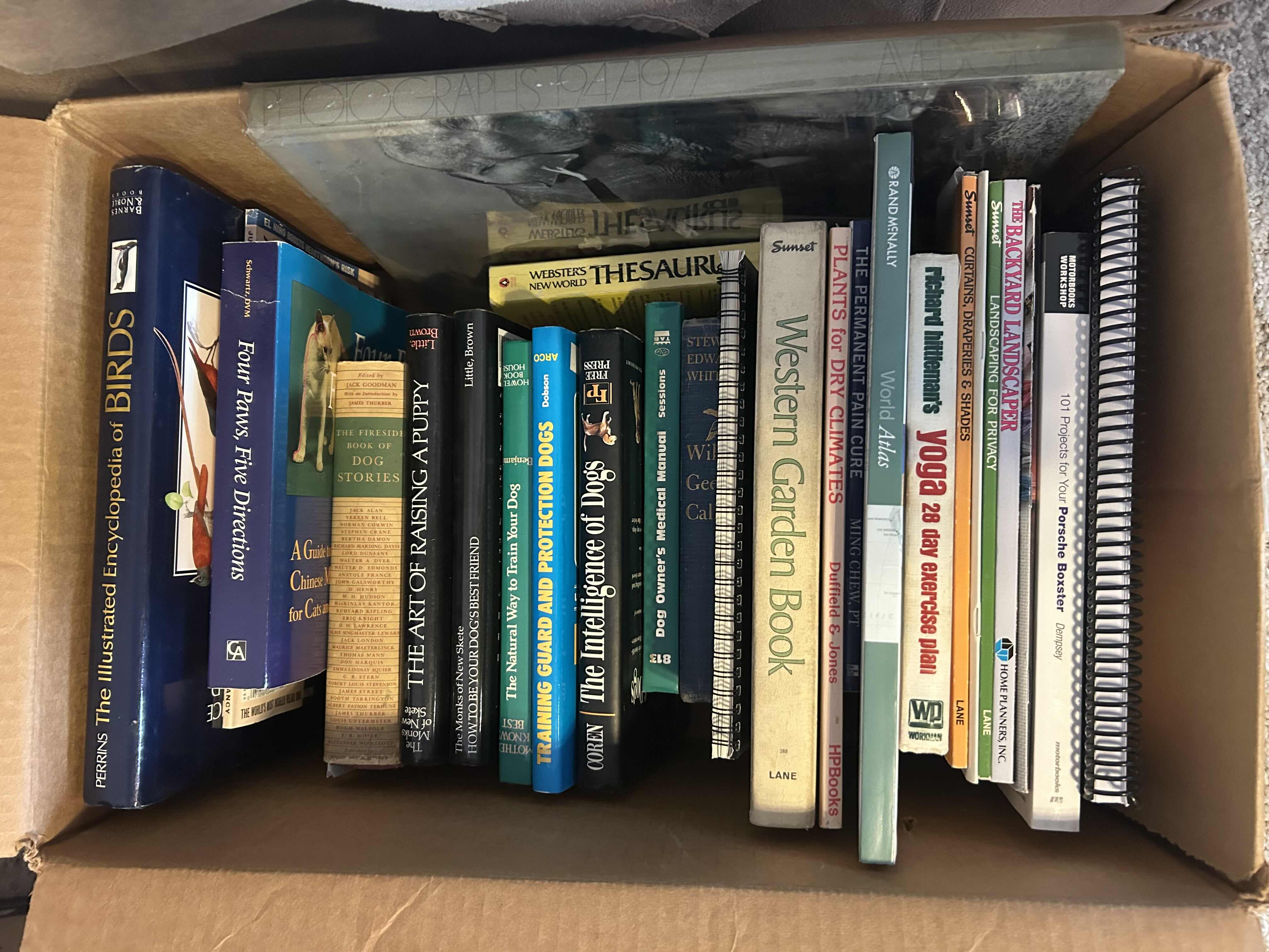 Photo 1 of BOX OF HOW-TO BOOKS. DOG TRAINING, GARDENING, AND HEALTH AND WELLNESS BOOKS.