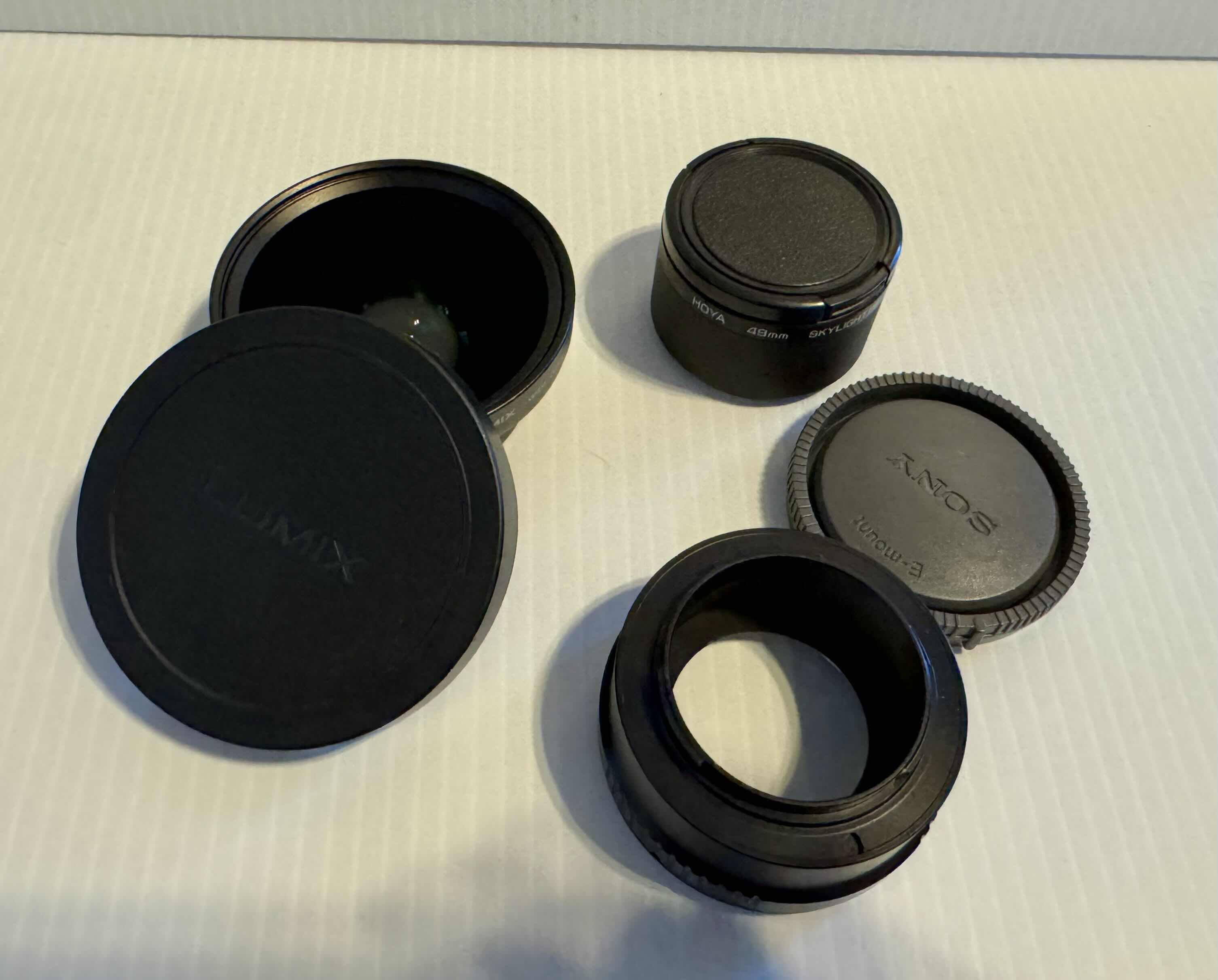 Photo 1 of ASSORTED CAMERA LENS COVERS