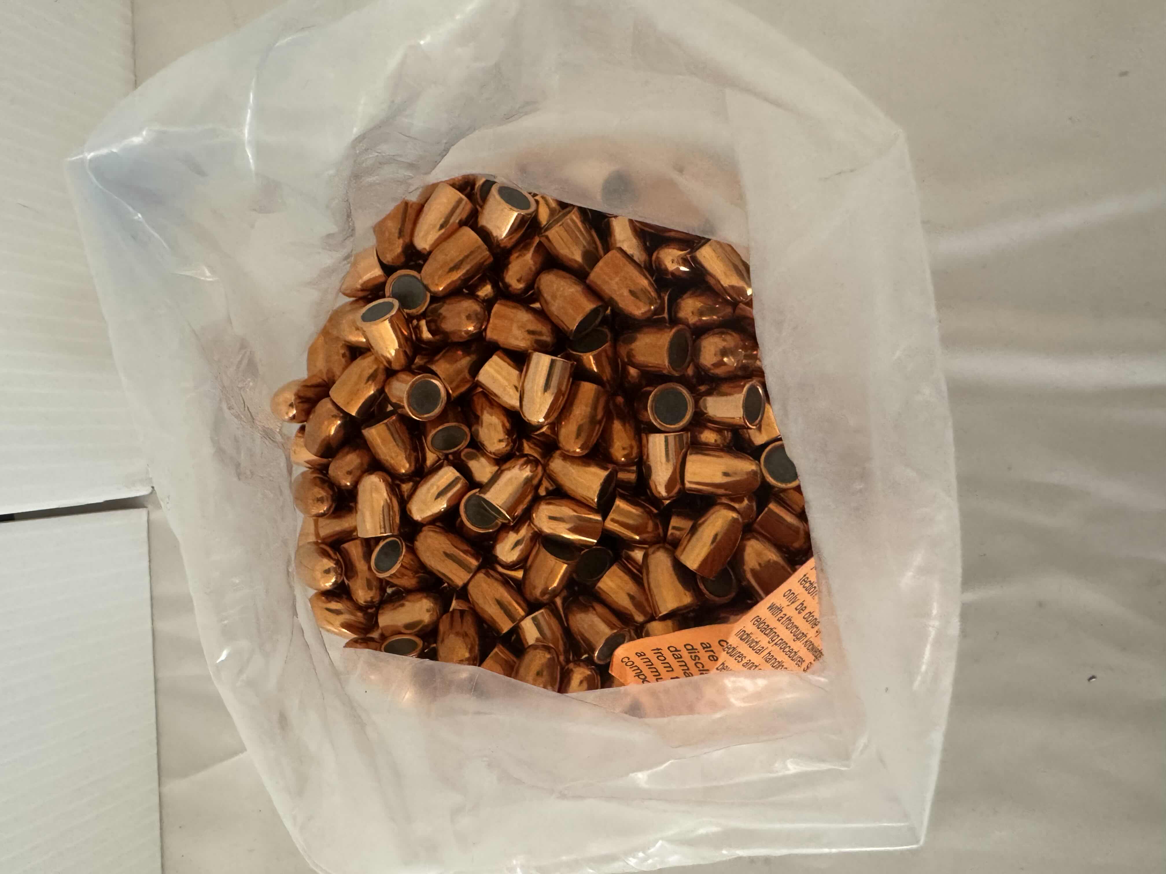 Photo 1 of BAG OF .45  95GRCOPPER PLATED BULLETS