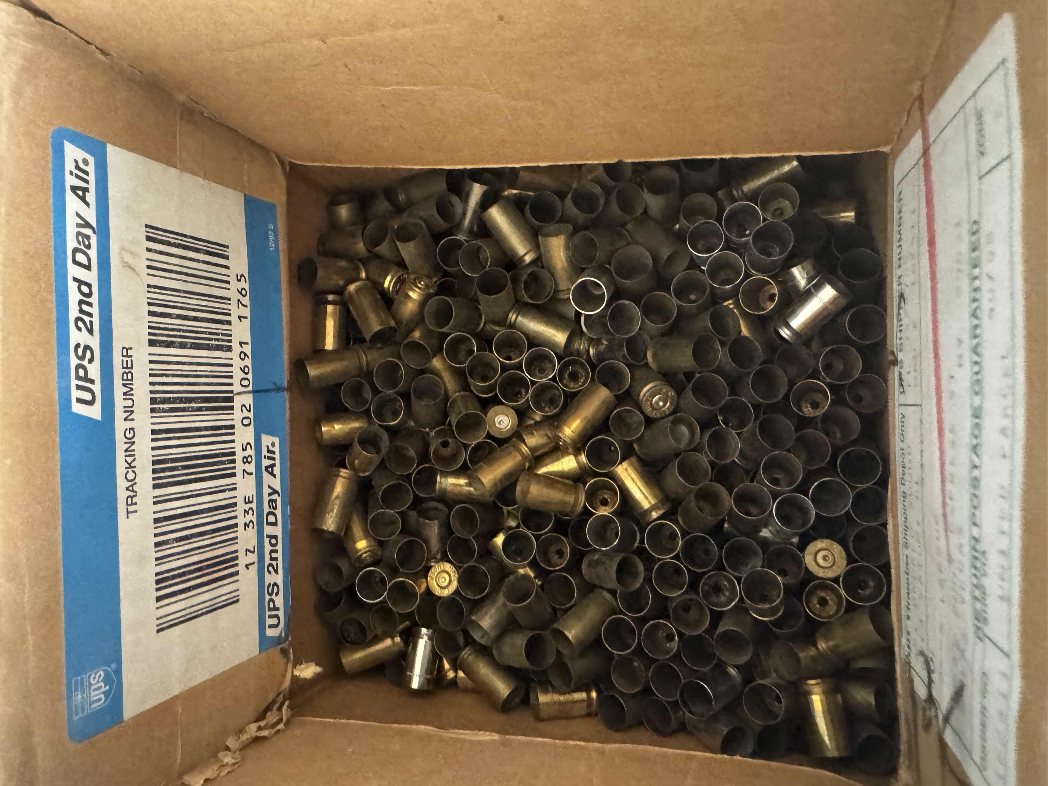 Photo 1 of ASSORTED SHELL CASINGS-AMMUNITION ACCESSORIES FOR FIREARMS.