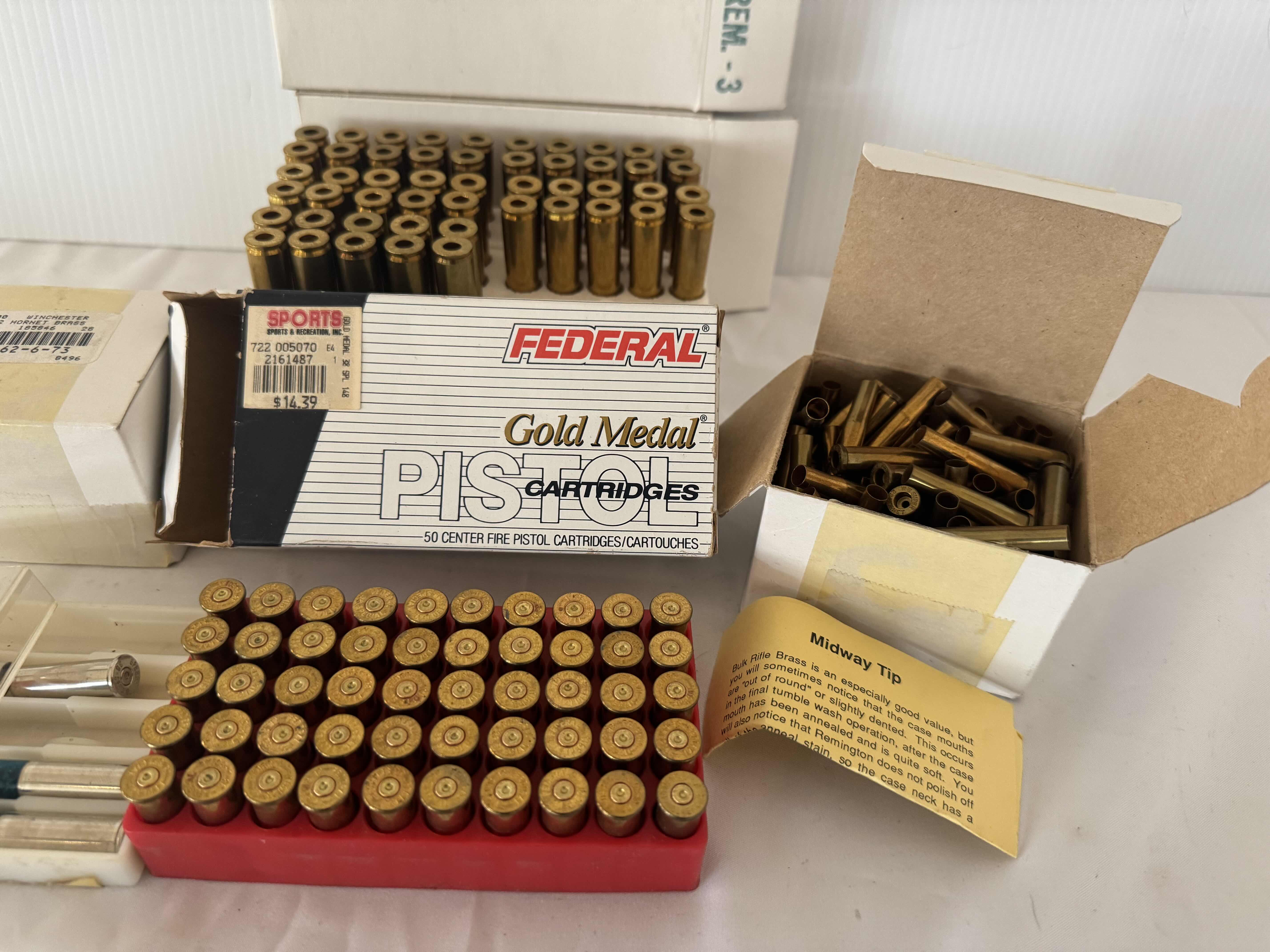 Photo 1 of ASSORTED BRASS CARTRIDGES. CCI SHOTSHELLS. GOLD MEDAL PISTOL CARTRIDGES-6MM REMINGTON, FIREARM AND GUN AMMUNITION ACCESSORIES.