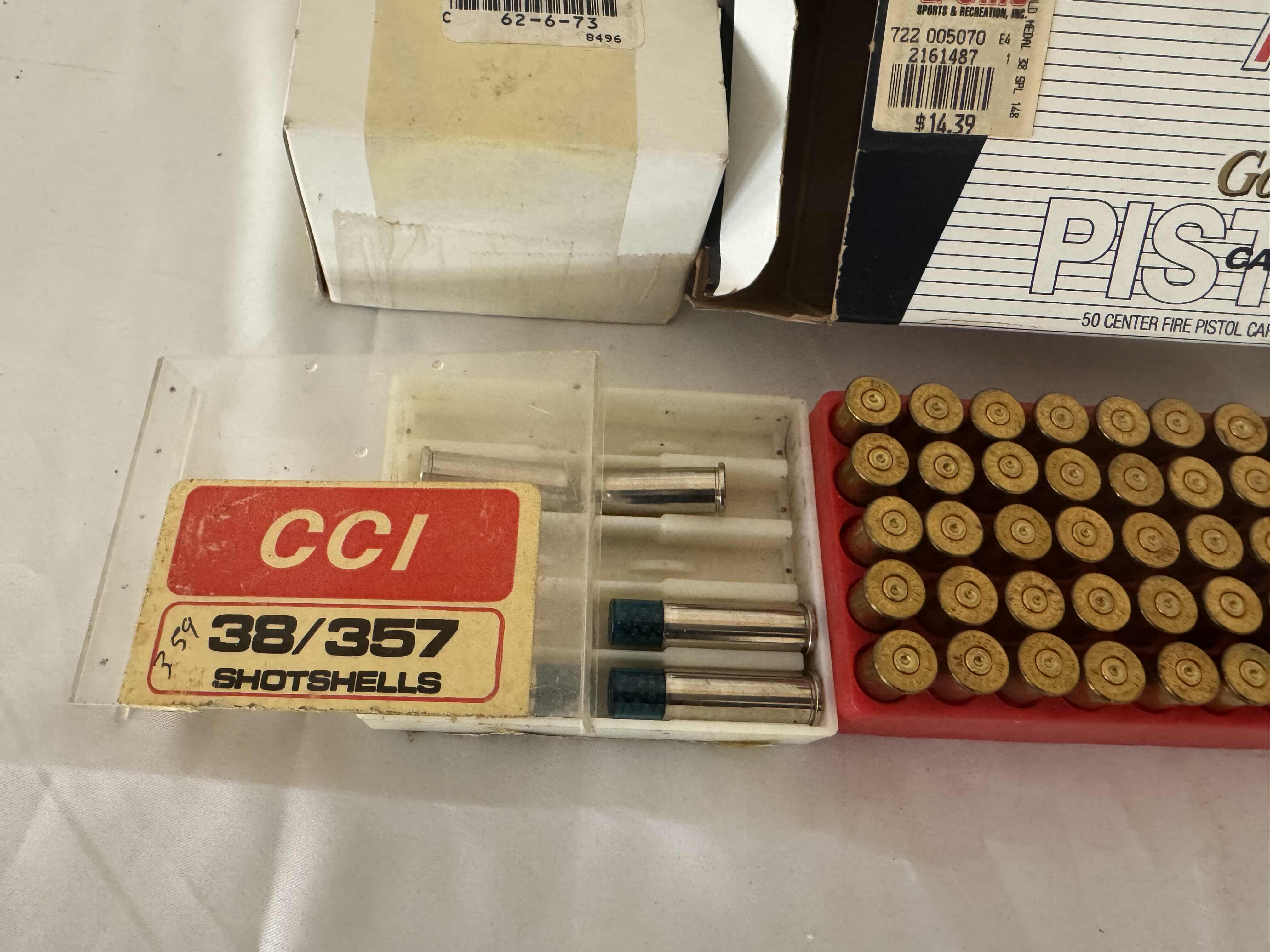 Photo 1 of ASSORTED BRASS CARTRIDGES. CCI SHOTSHELLS. GOLD MEDAL PISTOL CARTRIDGES-6MM REMINGTON, FIREARM AND GUN AMMUNITION ACCESSORIES.