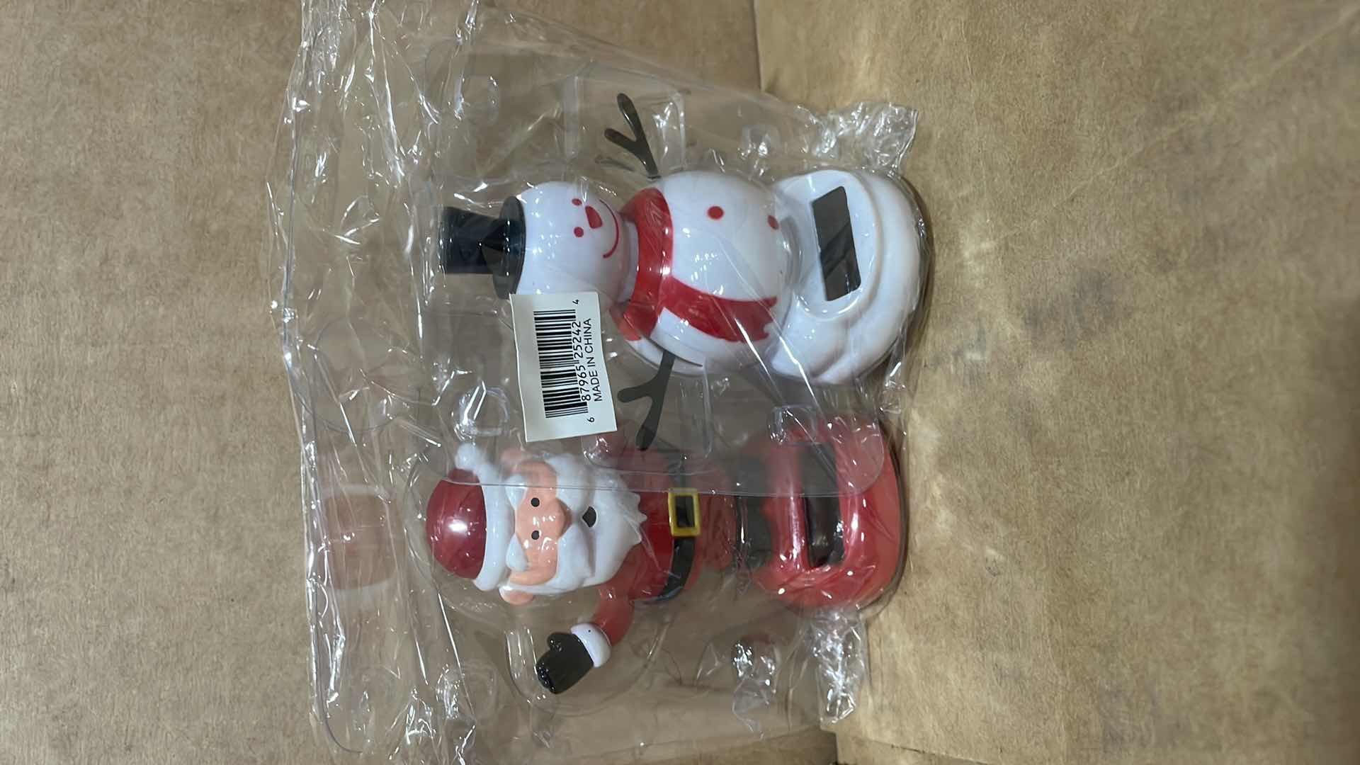 Photo 1 of CASE OF 50 SET OF CHRISTMAS SOLAR DANCING FIGURINES SANTA FROSTY THE SNOWMAN