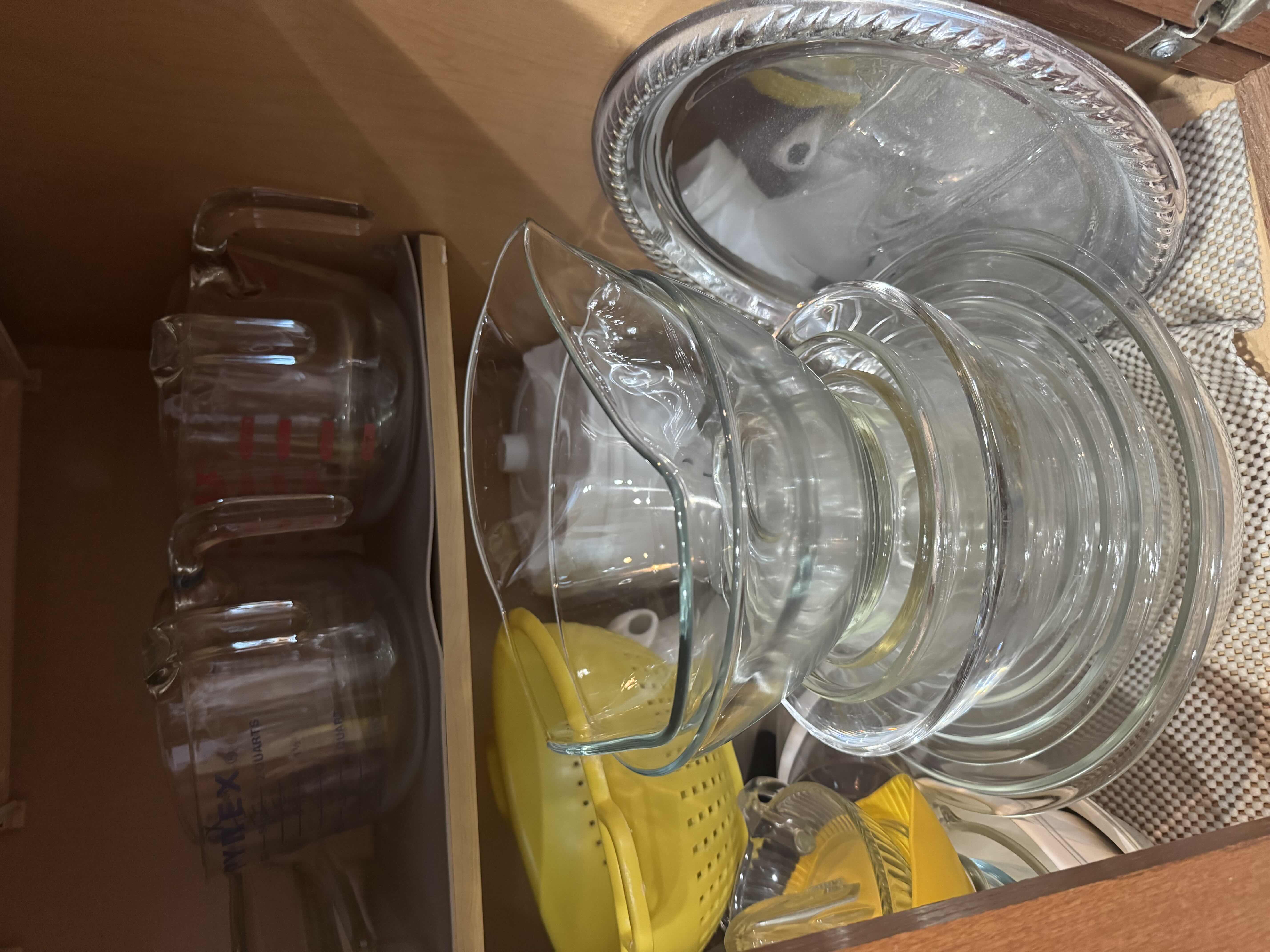 Photo 1 of CONTENTS OF CABINET: MIXING BOWLS, MEASURING CUPS, COLANDER,SALAD SPINNER