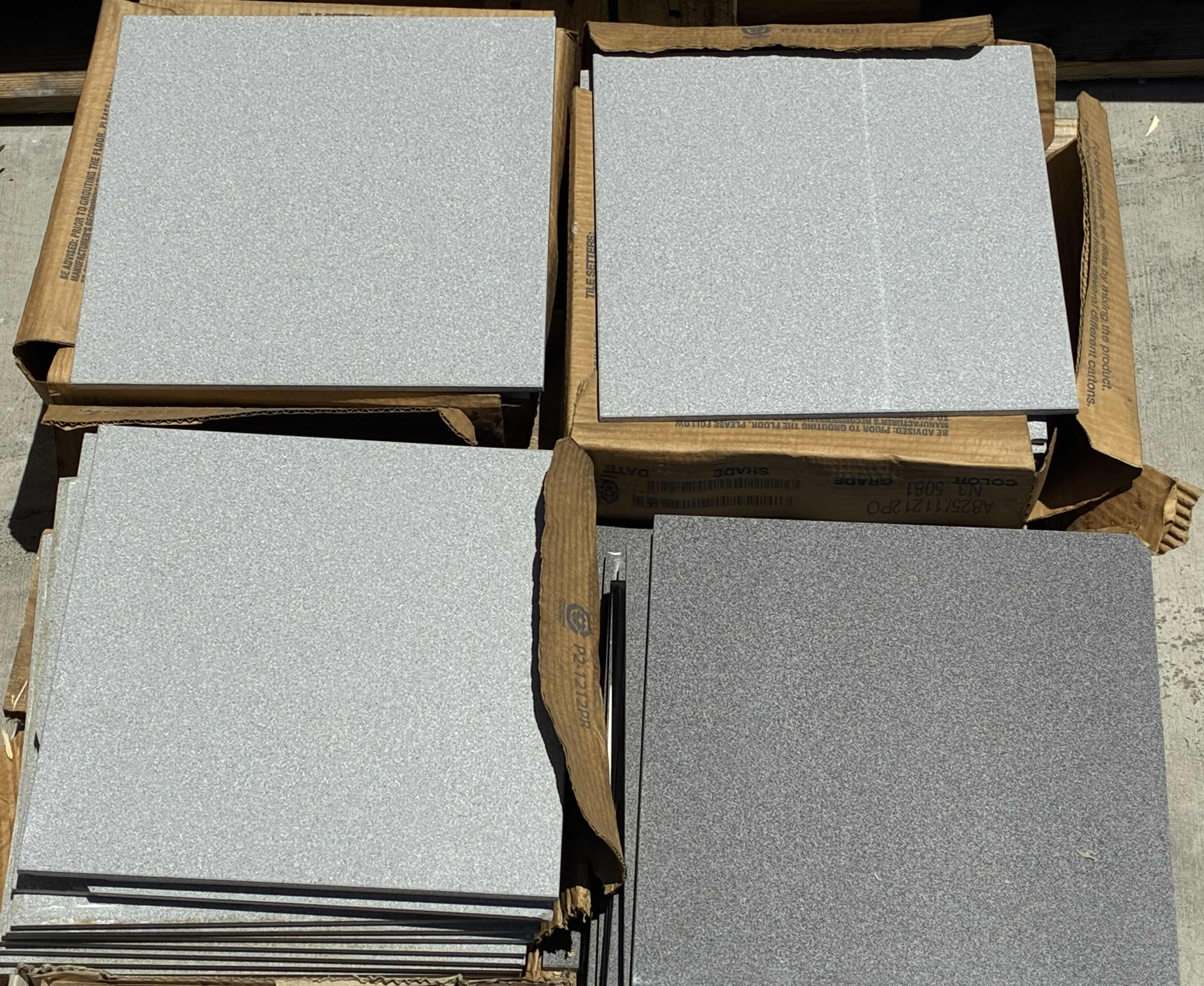 Photo 1 of MIXED STONE FINISH TILE PALLET-SQUARE TILE & MOSAIC TILE W FLOOR BASE TILE (APPROX 7 CASES TOTAL) READ NOTES
